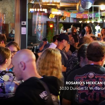 Crowd of people dining at Rosario's Mexican Cafe with colorful decorations and string lights in a lively indoor setting.