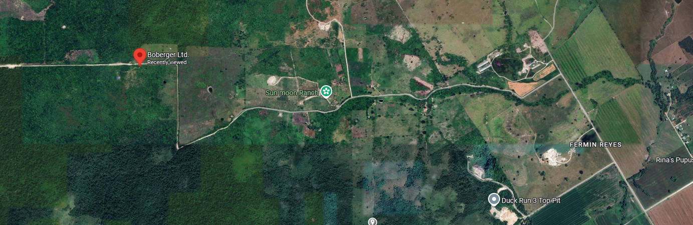 Satellite image of a rural area with roads, fields, forests, and some labeled locations like Boberger Ltd., Sun moon Ranch, FERMIN REYES, Rina's Pupu, and Duck Run 3 Top Pit.