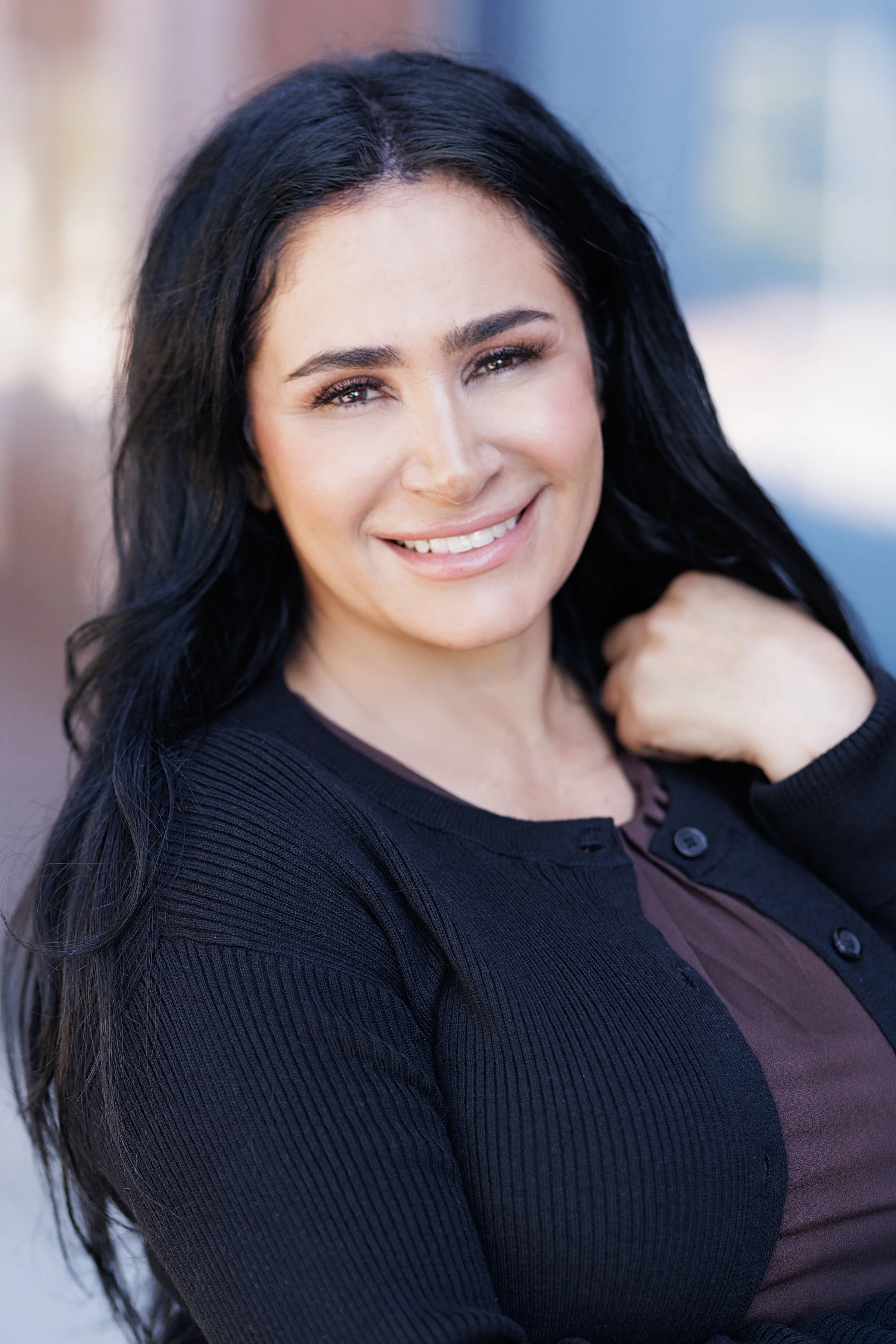 Bahareh Saidian smiling warmly in a natural light headshot.