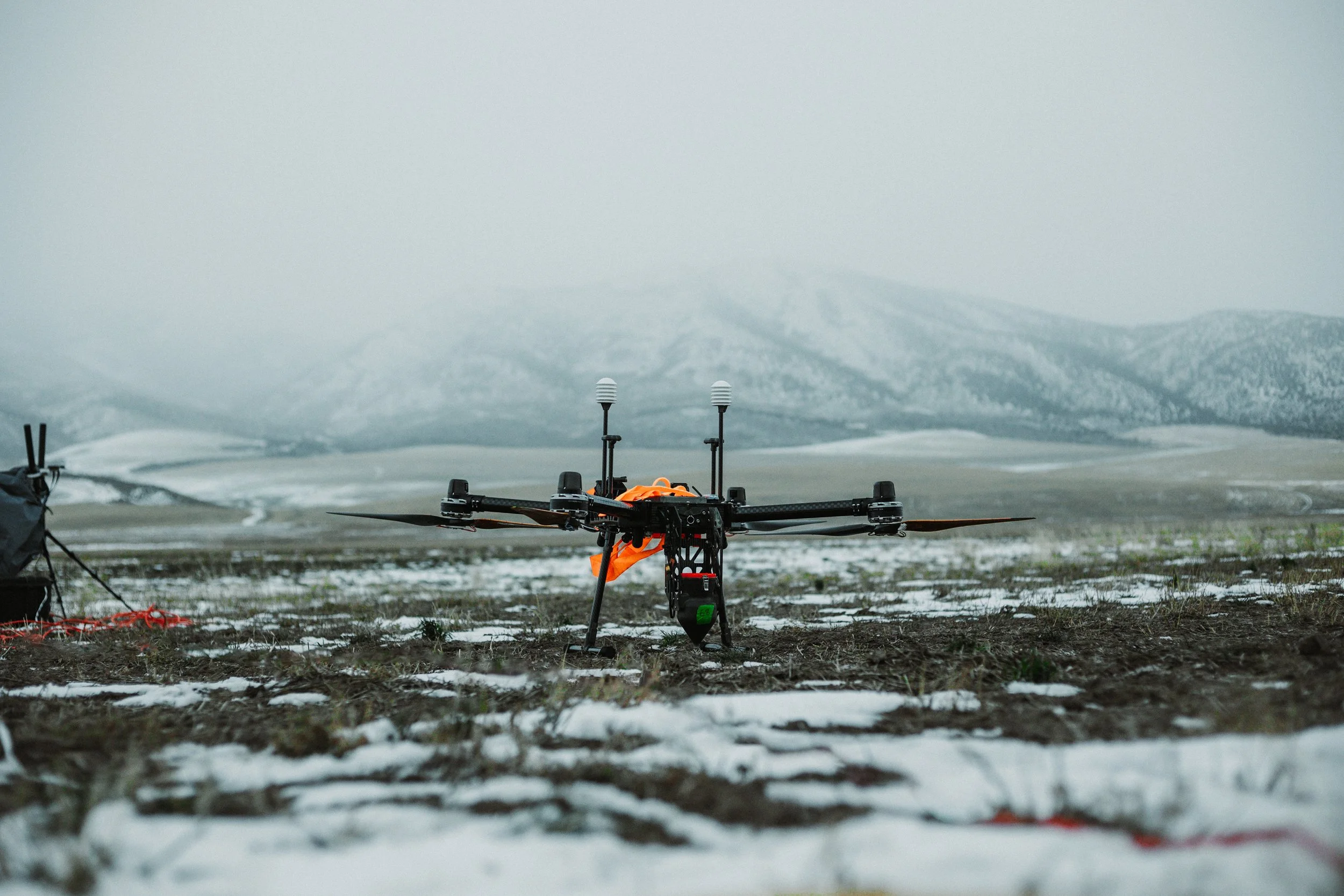 Cloud seeding drone shown in the middle of a snowy Idaho field