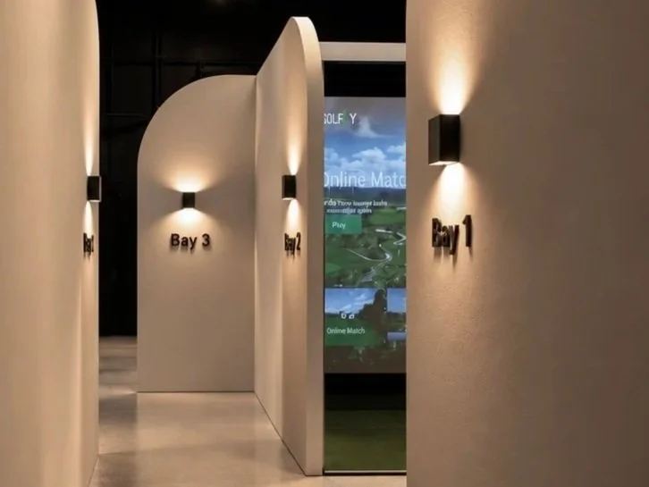 Indoor golf simulator bays at ALIGN Golf Studio in Chino, California