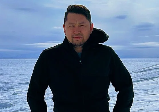 Photo of Joey Partridge on the tundra in winter.