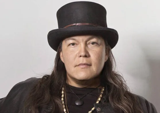 Photo of Raven Polson-Lahache wearing a top hat.