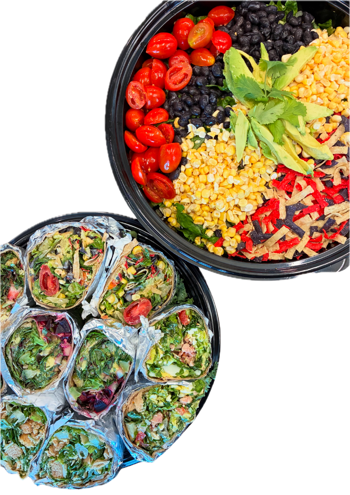 A large salad bowl with cherry tomatoes, black beans, corn, sliced avocado, and shredded cheese. A smaller tray of sliced wraps filled with similar ingredients, wrapped in aluminum foil.