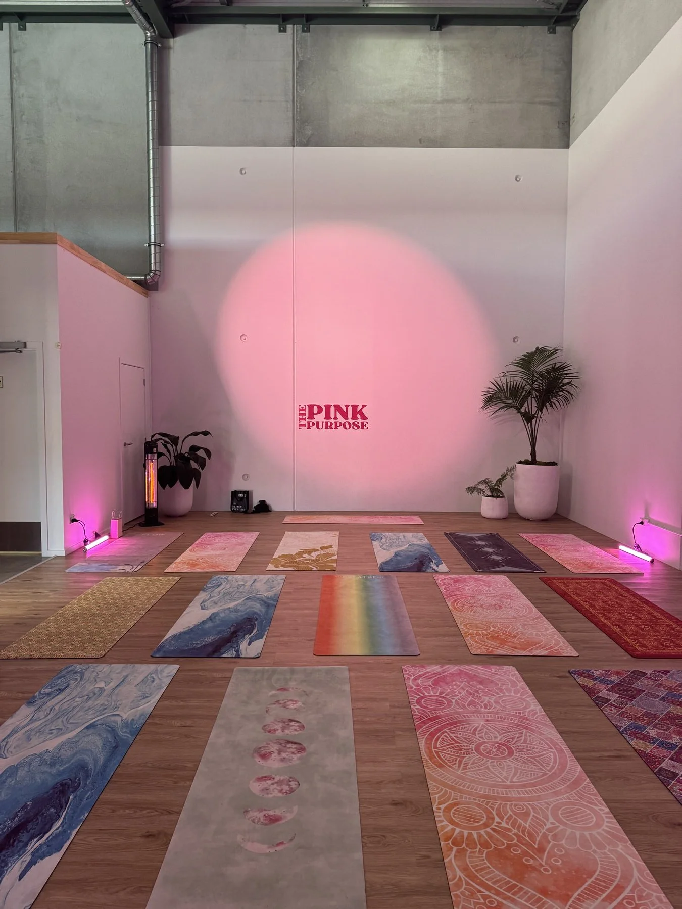 pink-purpose-yoga-studio-event-mat-setup.jpeg