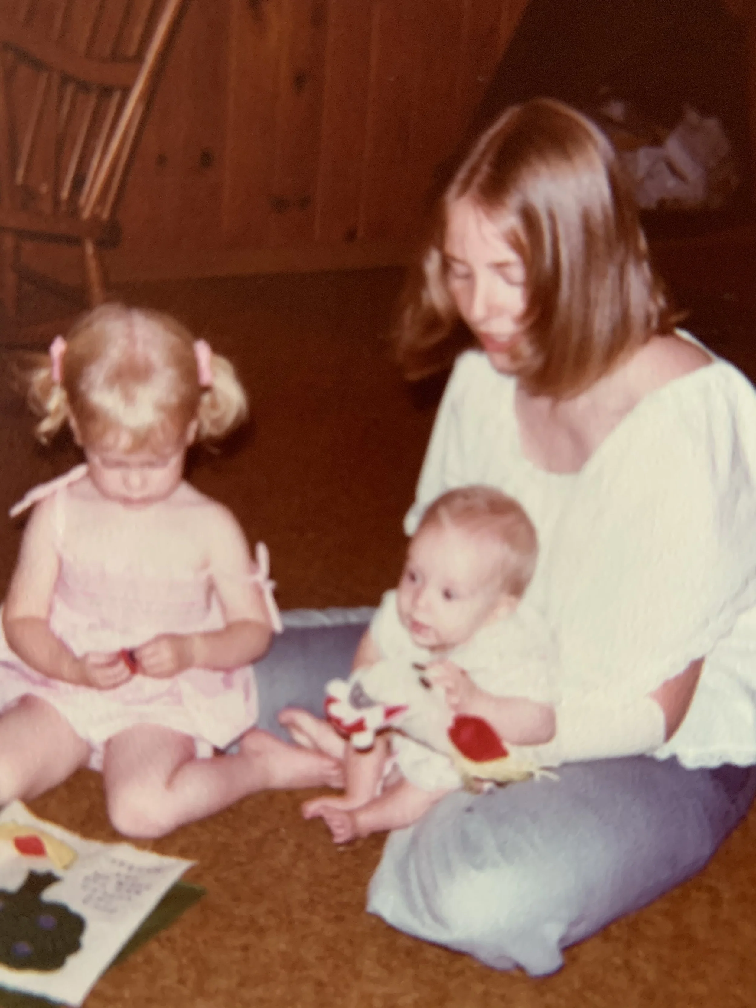 Childhood photograph of The Deep Current Collective founder with family, representing early life and personal story.