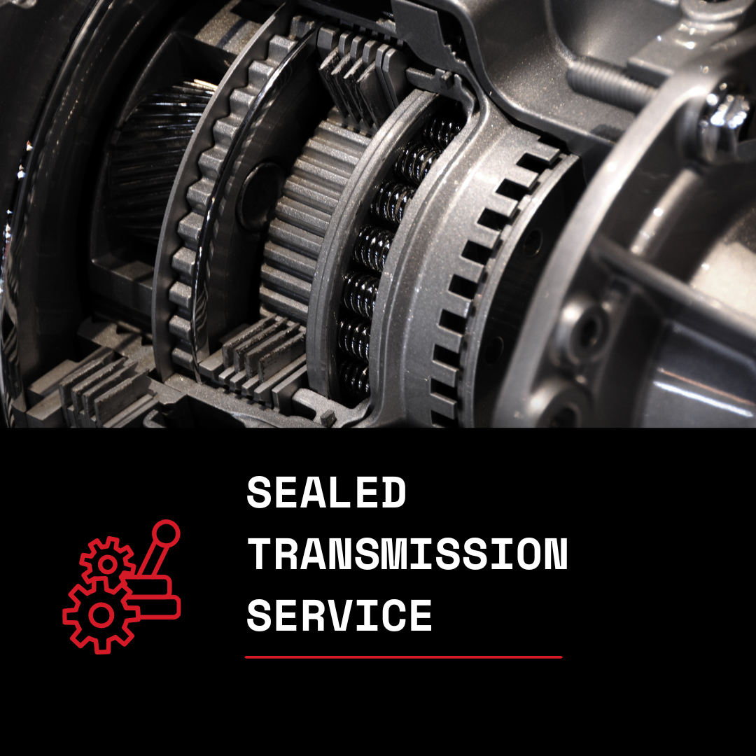 Close-up of internal gears and components of a sealed automatic transmission system with a label for sealed transmission service.