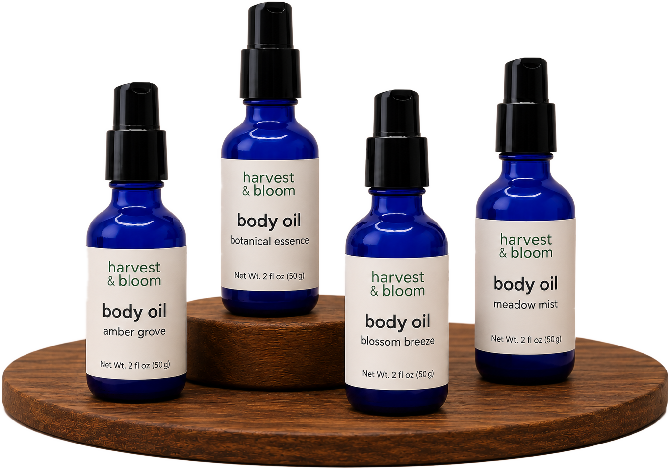 Shop Harvest and Bloom lightweight botanical body oil lineup showing the signature blue glass bottles on a wooden tray.