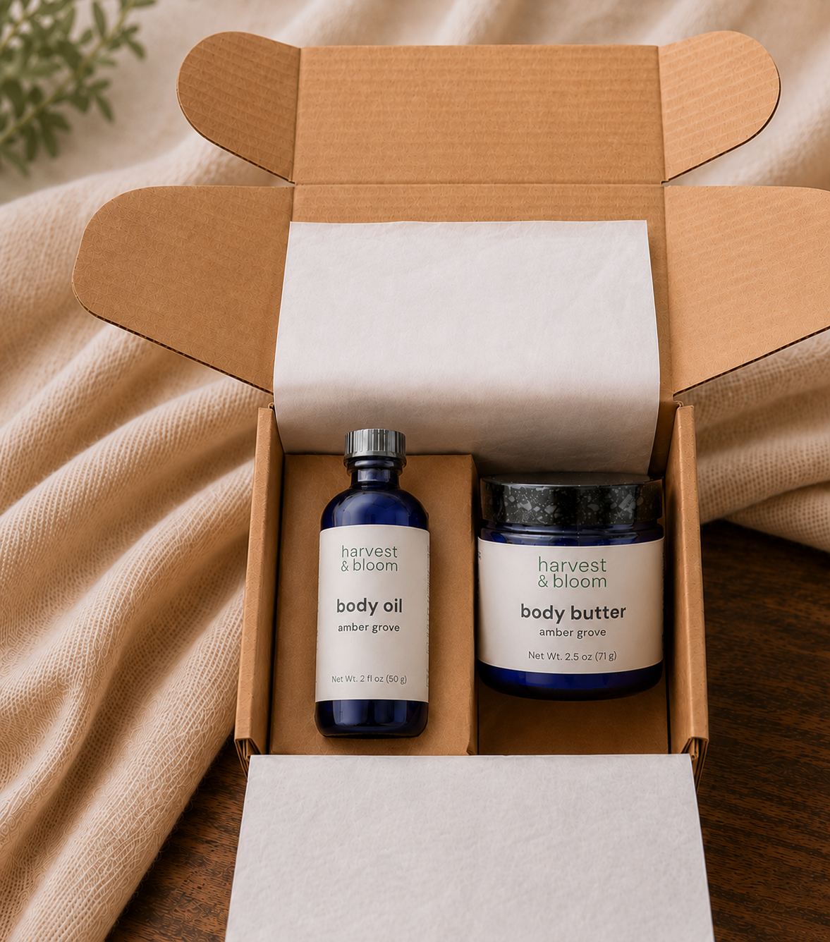 An open kraft paper gift box showcasing a curated harvest and bloom botanical body care ritual set neatly nestled inside.