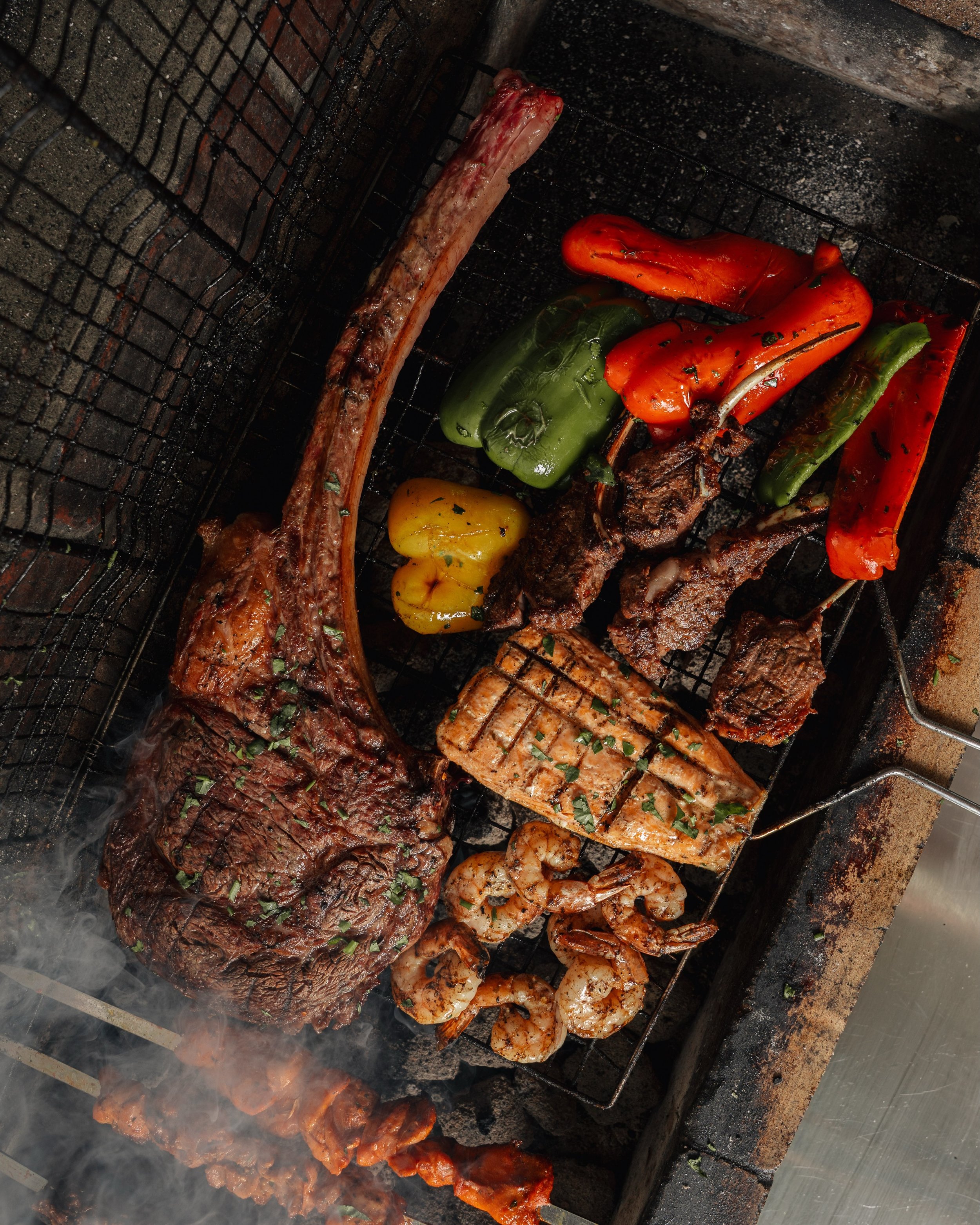 A &mdash; House &mdash; Staple

Our signature charcoal-grill is well prepared before the doors unlock, before the curtains open and before the tables are set. 

A true staple of our brand and an identity to our dishes, awaits you. 

For reservations,