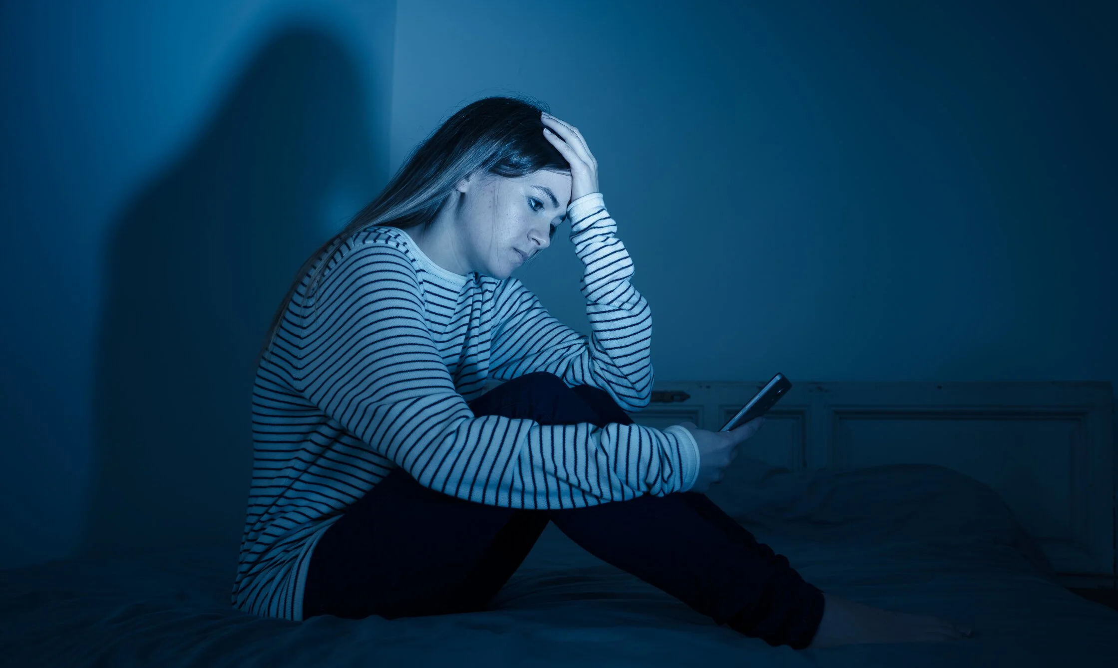 a person experiencing distress, often used in contexts relating to cyberbullying or social media addiction