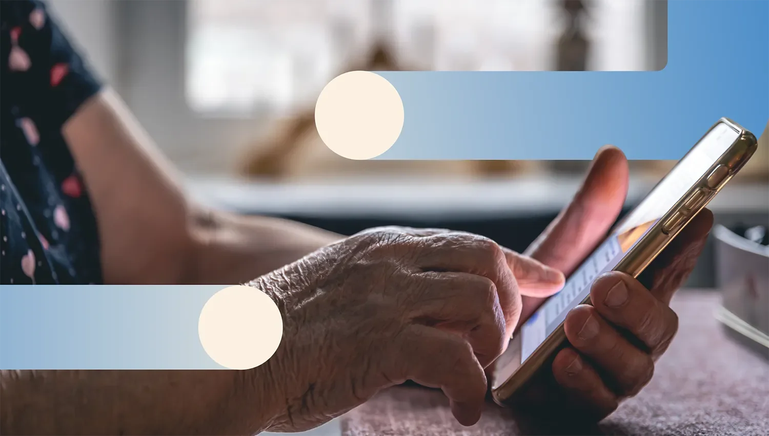An elderly person's hand holding a smartphone and typing on it. The person is surrounded by two blue and cream abstract line connectors, acting as beams of light, recovery and support.