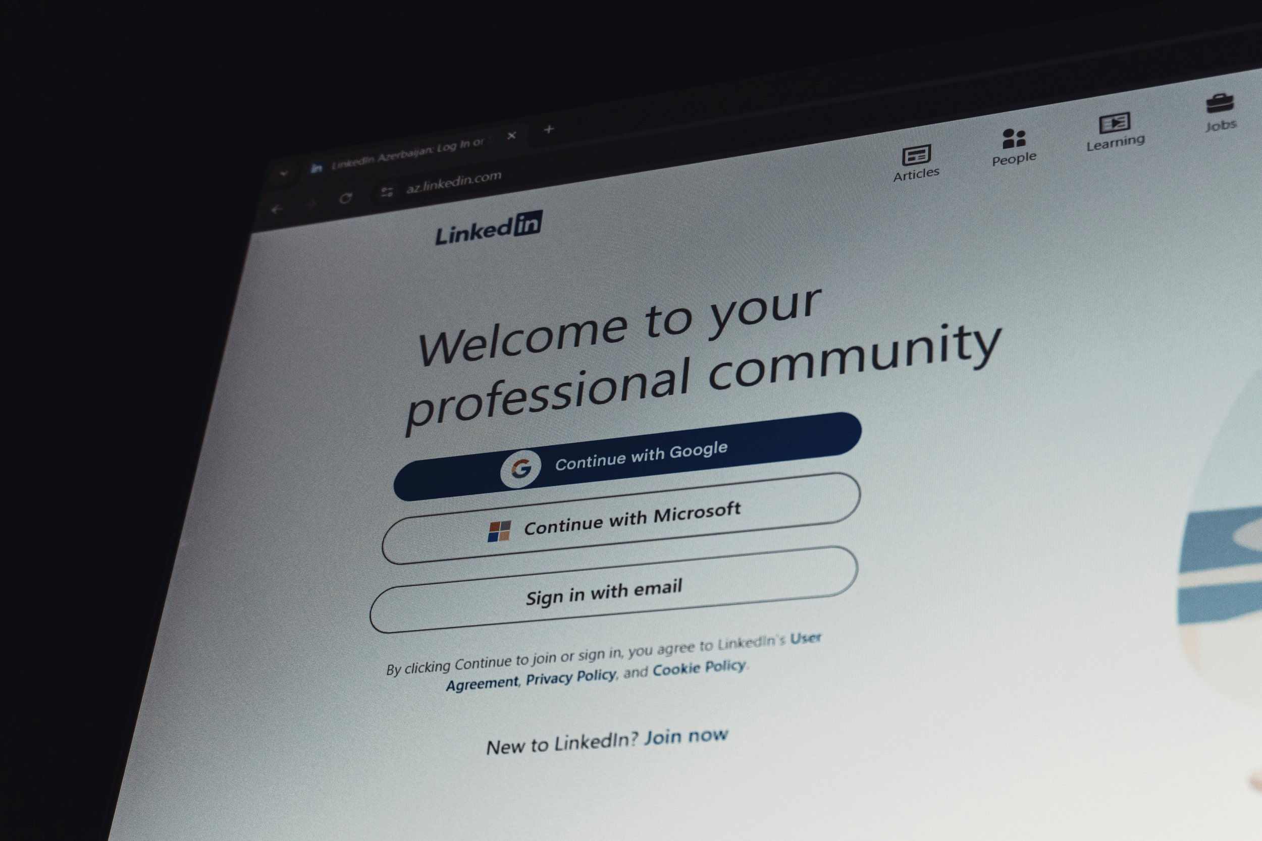 A screen displaying the LinkedIn login page, showing sign-in options via Google, Microsoft, or email.