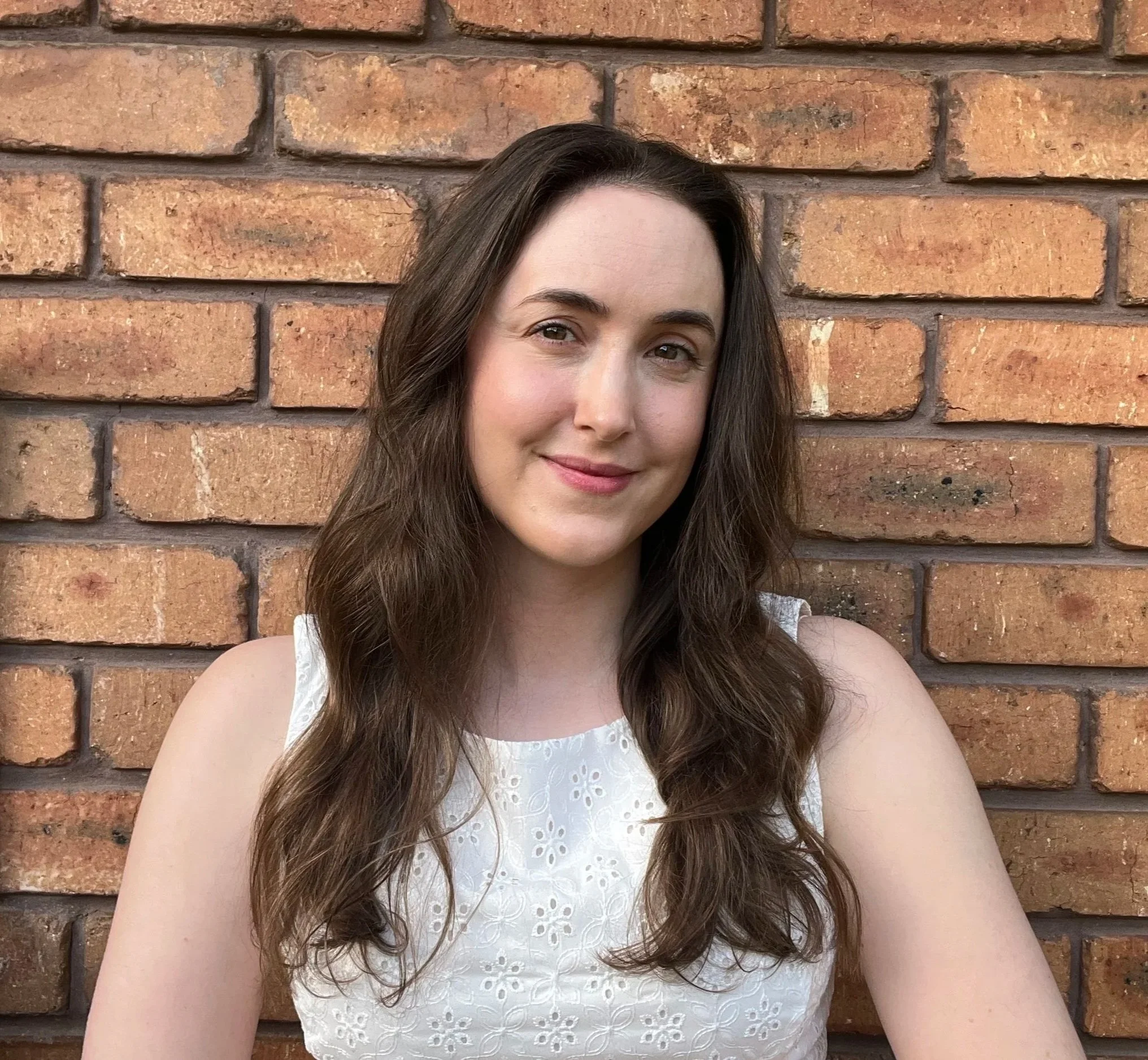 Stephanie Kline in front of brick wall