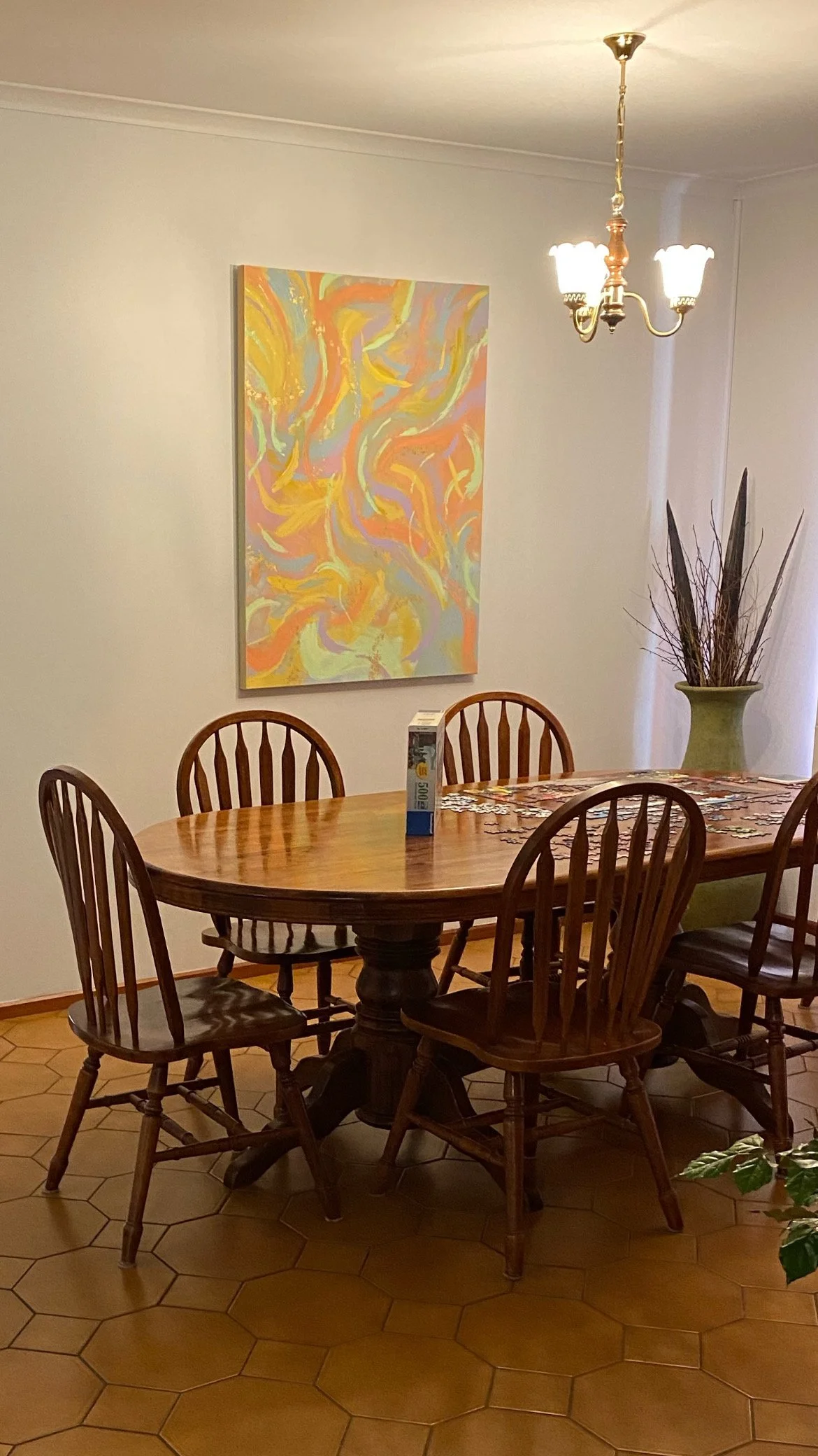 painting above a dinning room table