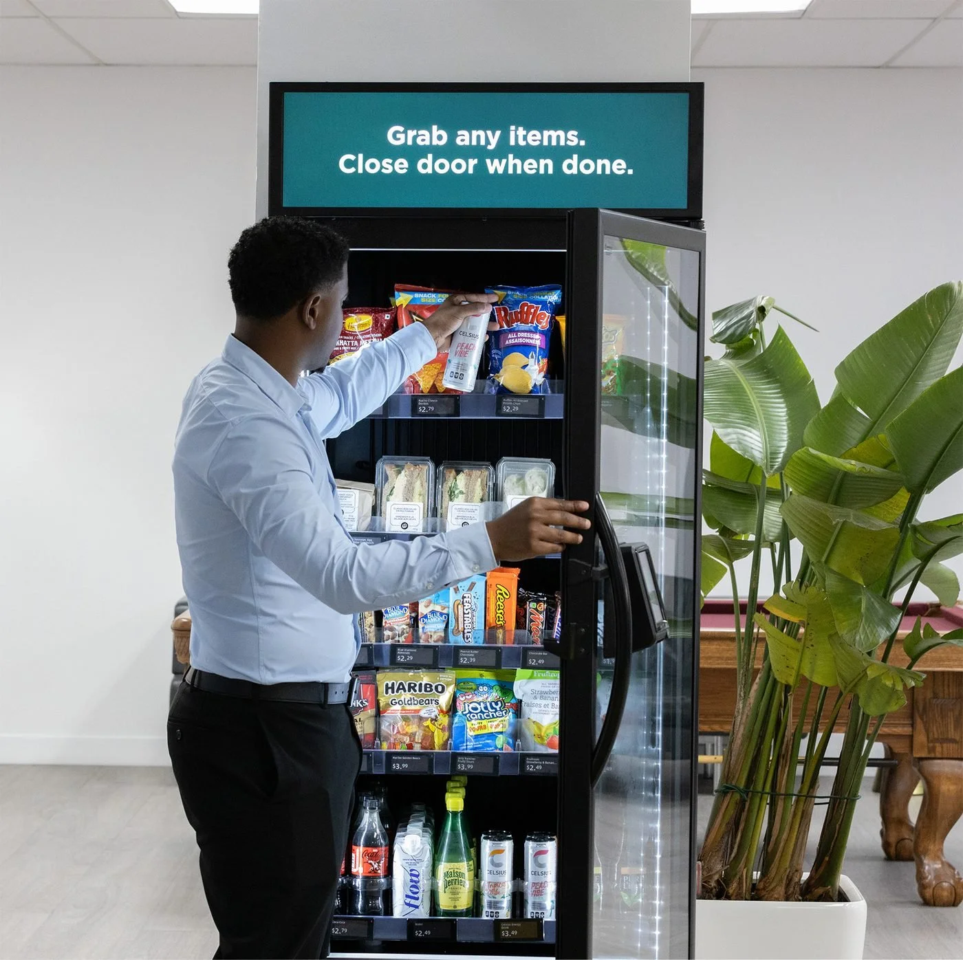 Taking an item off the shelf of an open GrabNGo market