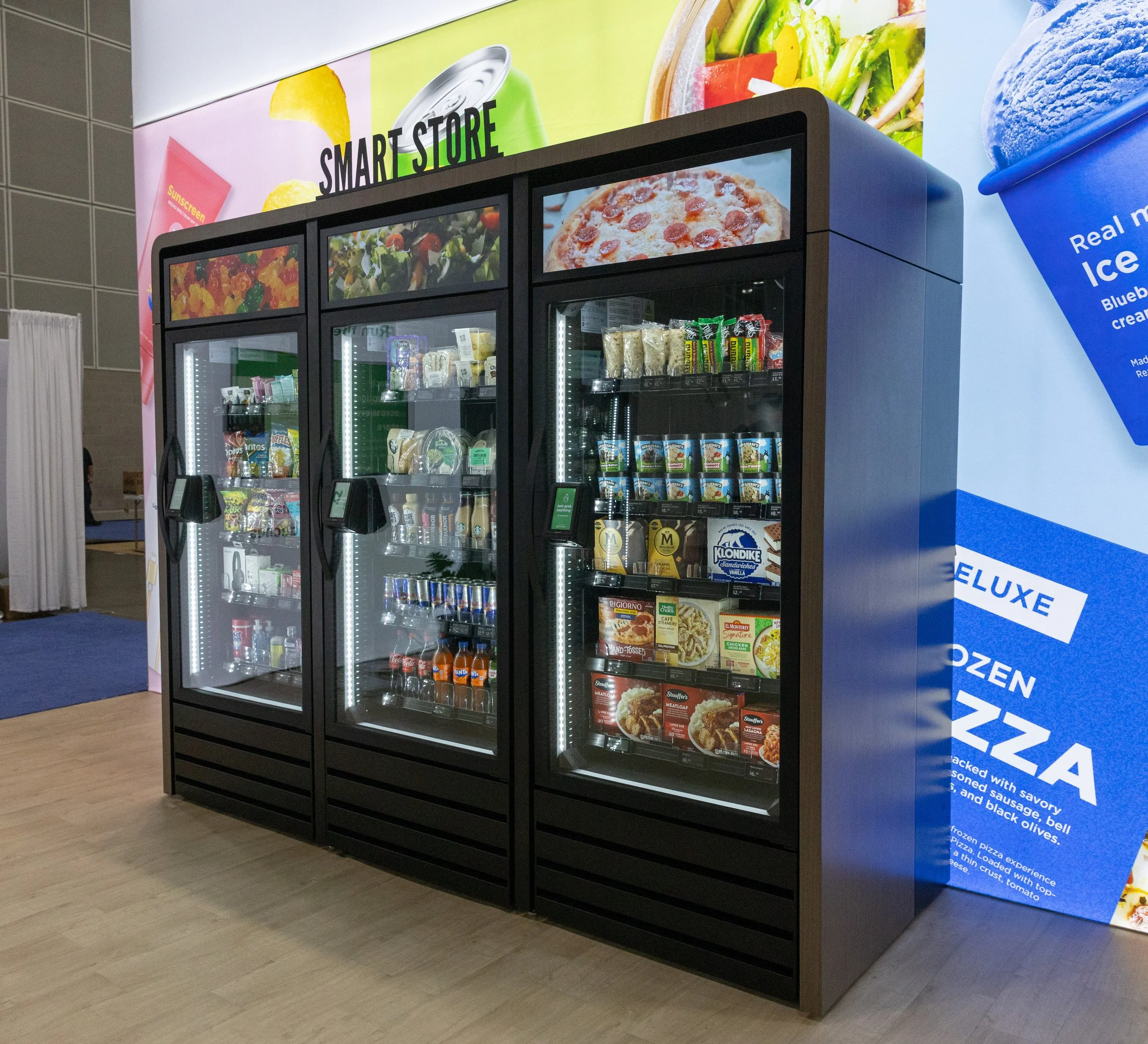 Closing the door of a GrabNGo smart market to finish the purchase