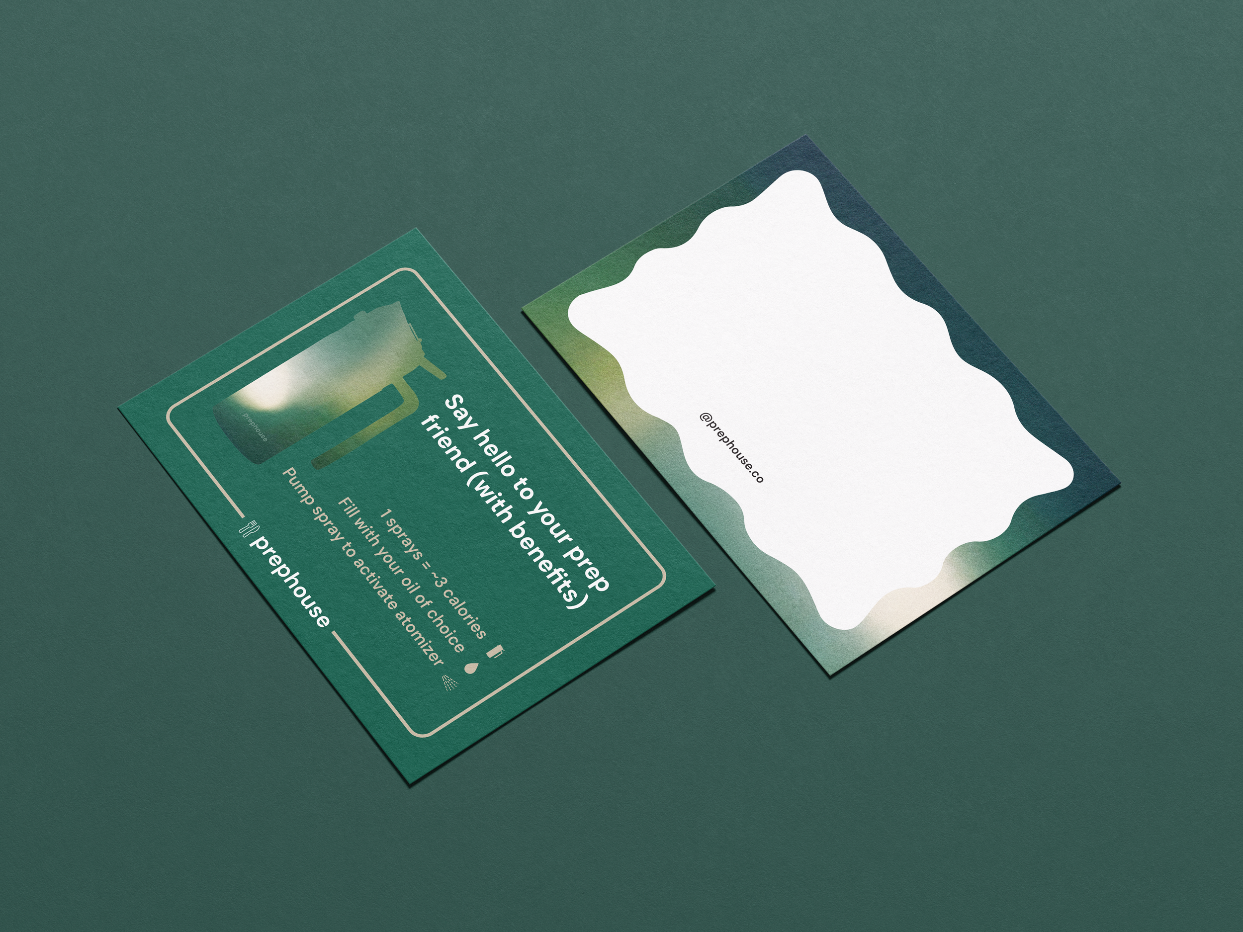 Green pamphlet and white card on green surface. The pamphlet shows a silhouette of a growler with the text "Say hello to your friend" and other text about oil spraying, while the white card has a wavy top edge and the social media handle '@prephouse.