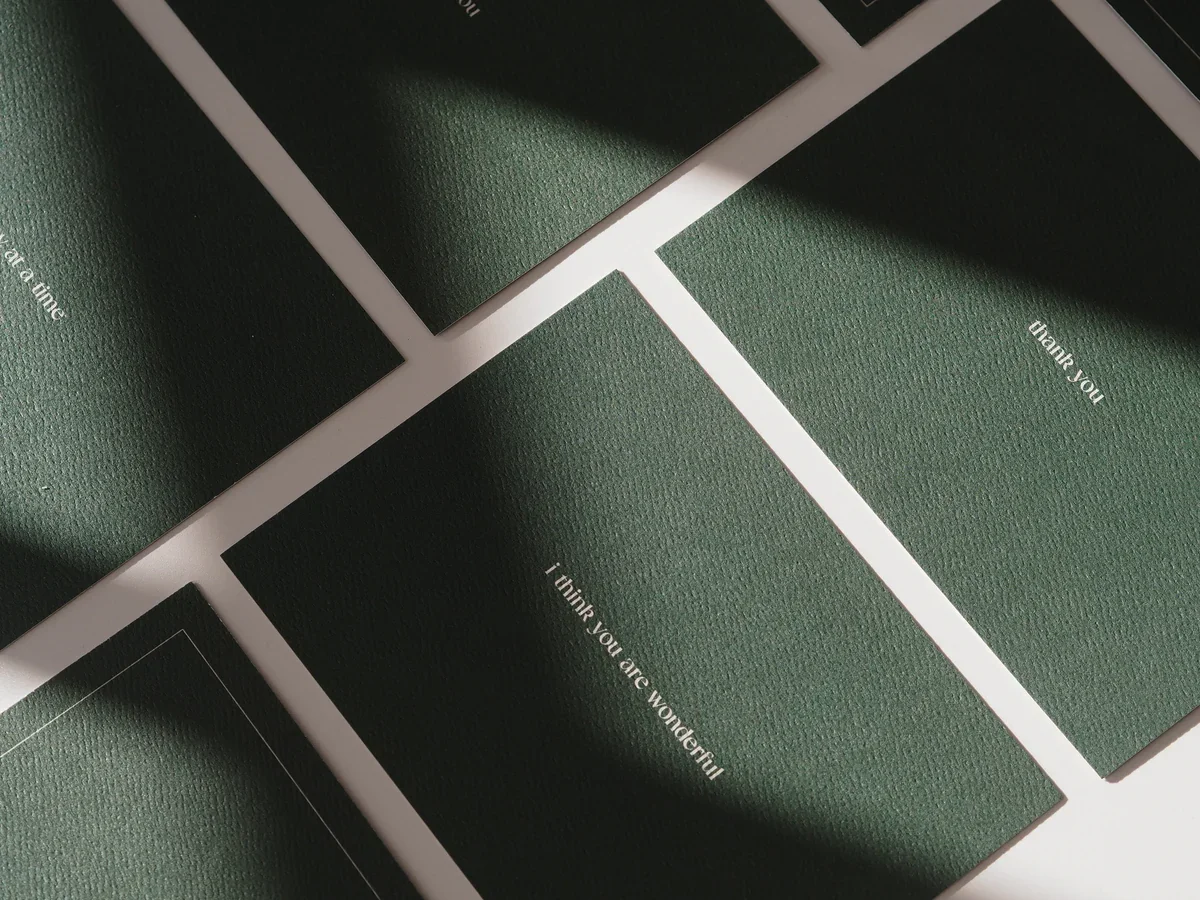 Green textured cards with white text saying 'thank you' or 'i think you are wonderful'