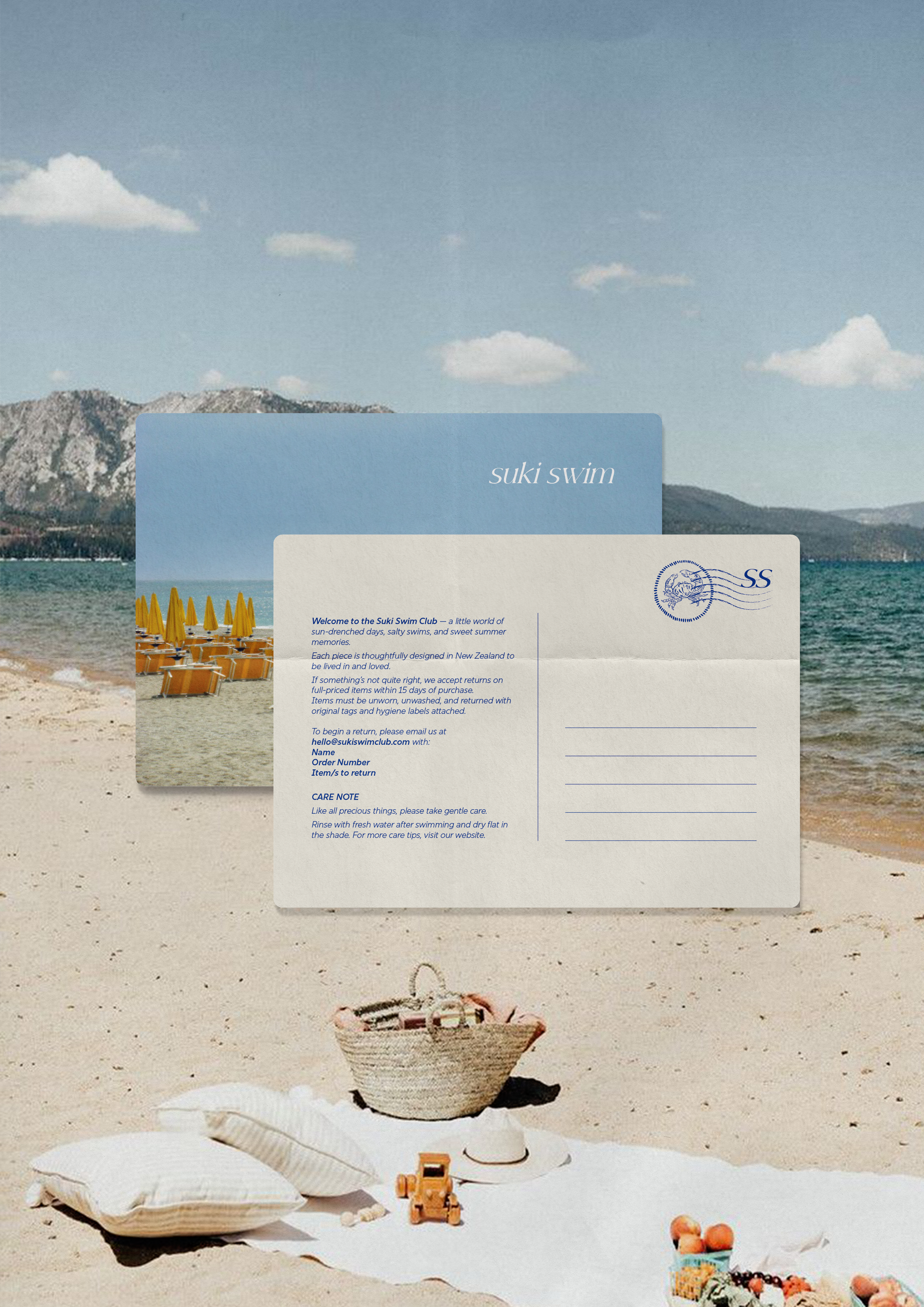 Beach scene with umbrellas, beach chairs, a woven basket, seashells, a toy truck, oranges, and a 'Suki Swim' brochure overlayed on the sky and mountains in the background.