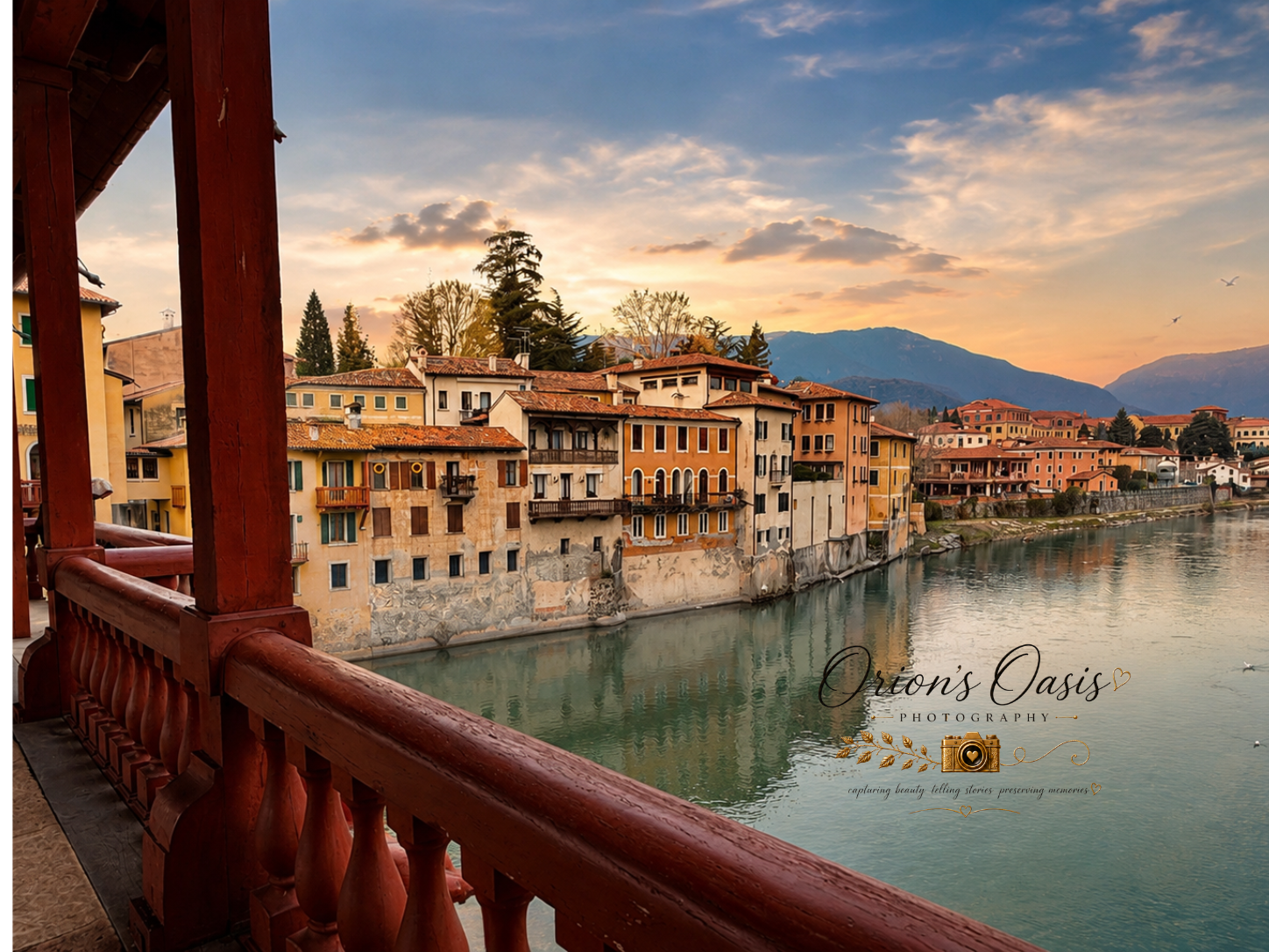 Scenic view of colorful buildings along a river at sunset, viewed from a wooden balcony.