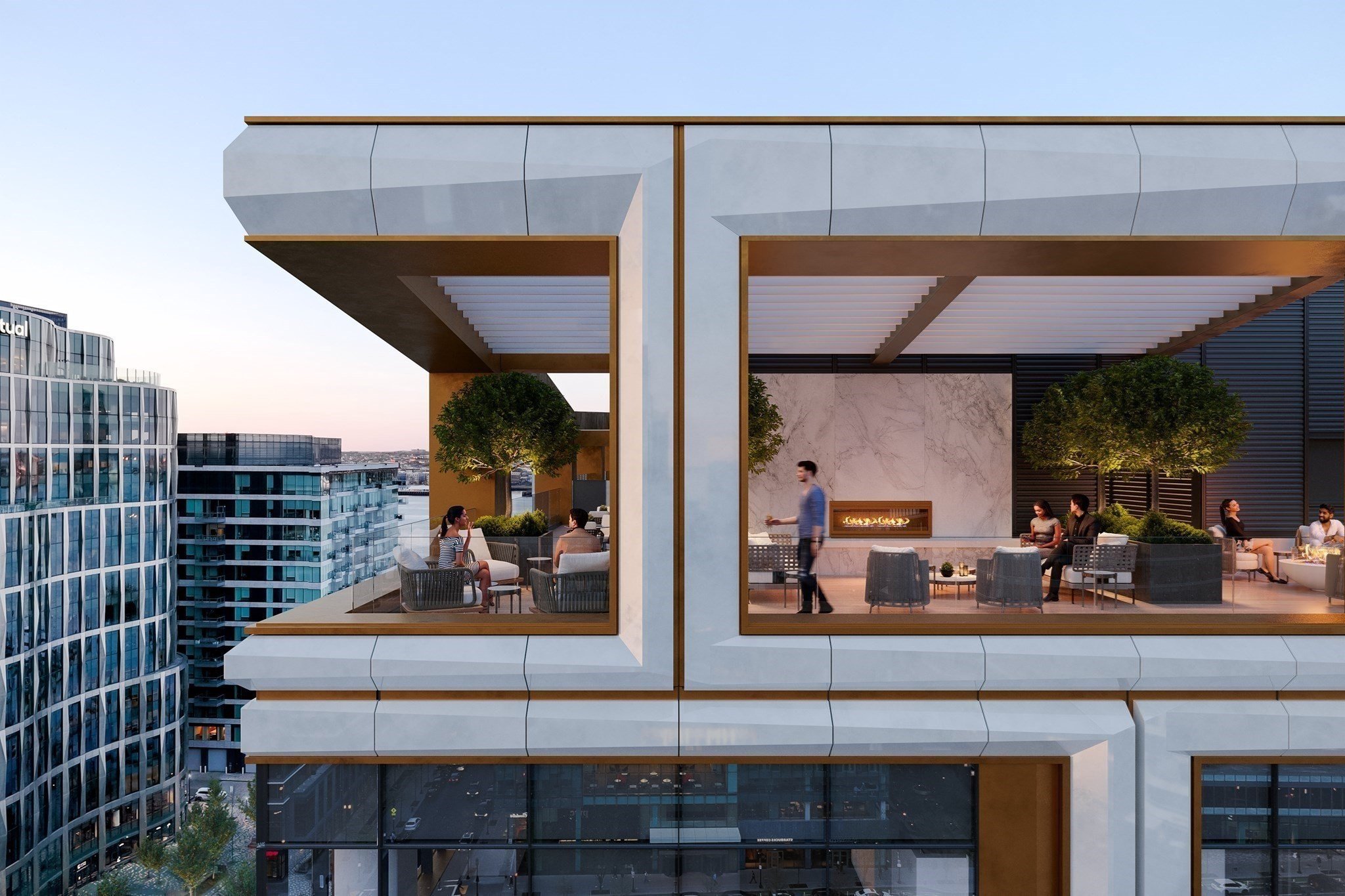 Modern rooftop lounge with outdoor seating, fire feature, greenery, and city views
