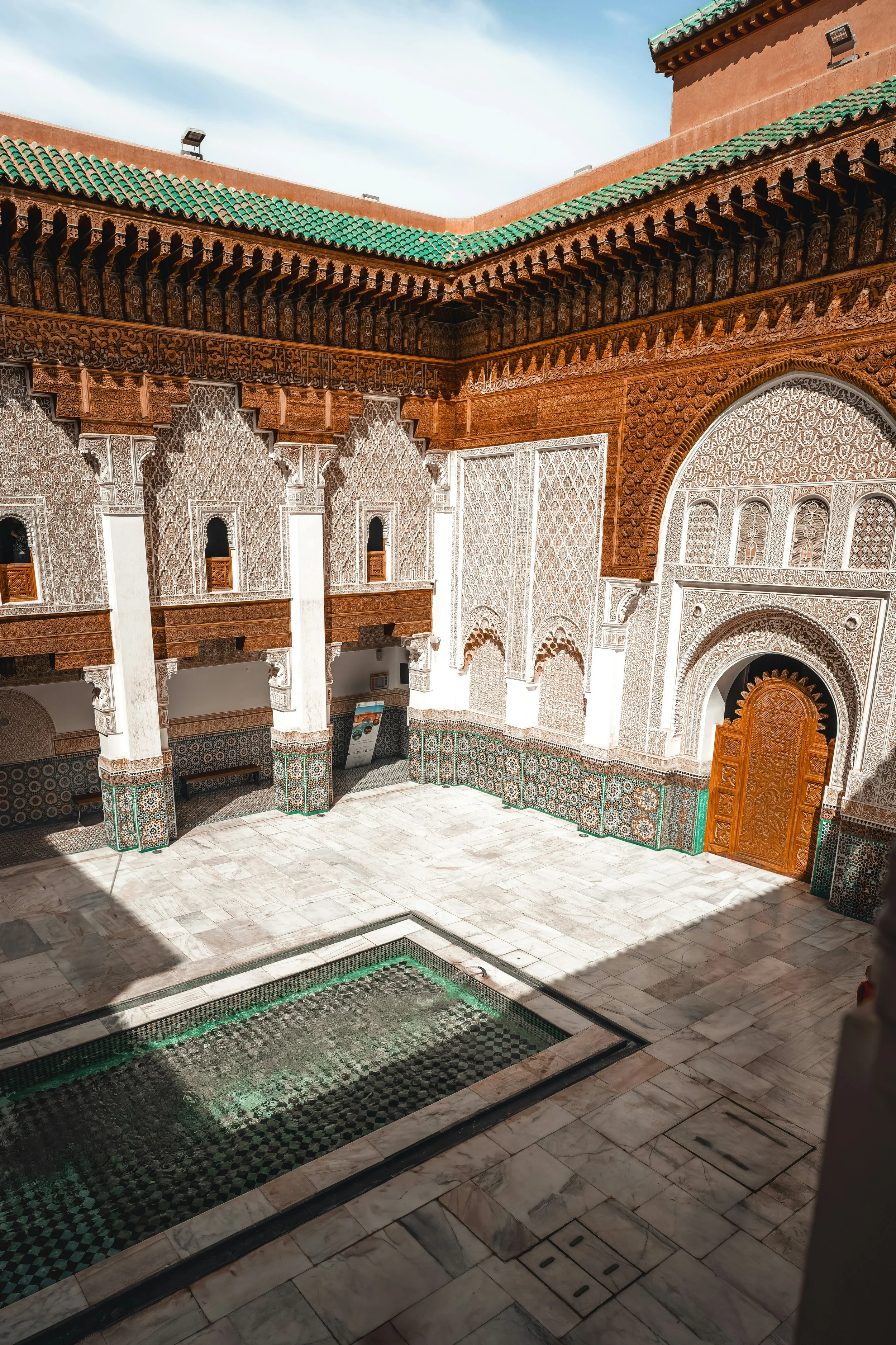 Morocco Vistas | Moorish & Andalusian Heritage — courtyard fountain and carved plasterwork, Ben Youssef Madrasa, Marrakech
