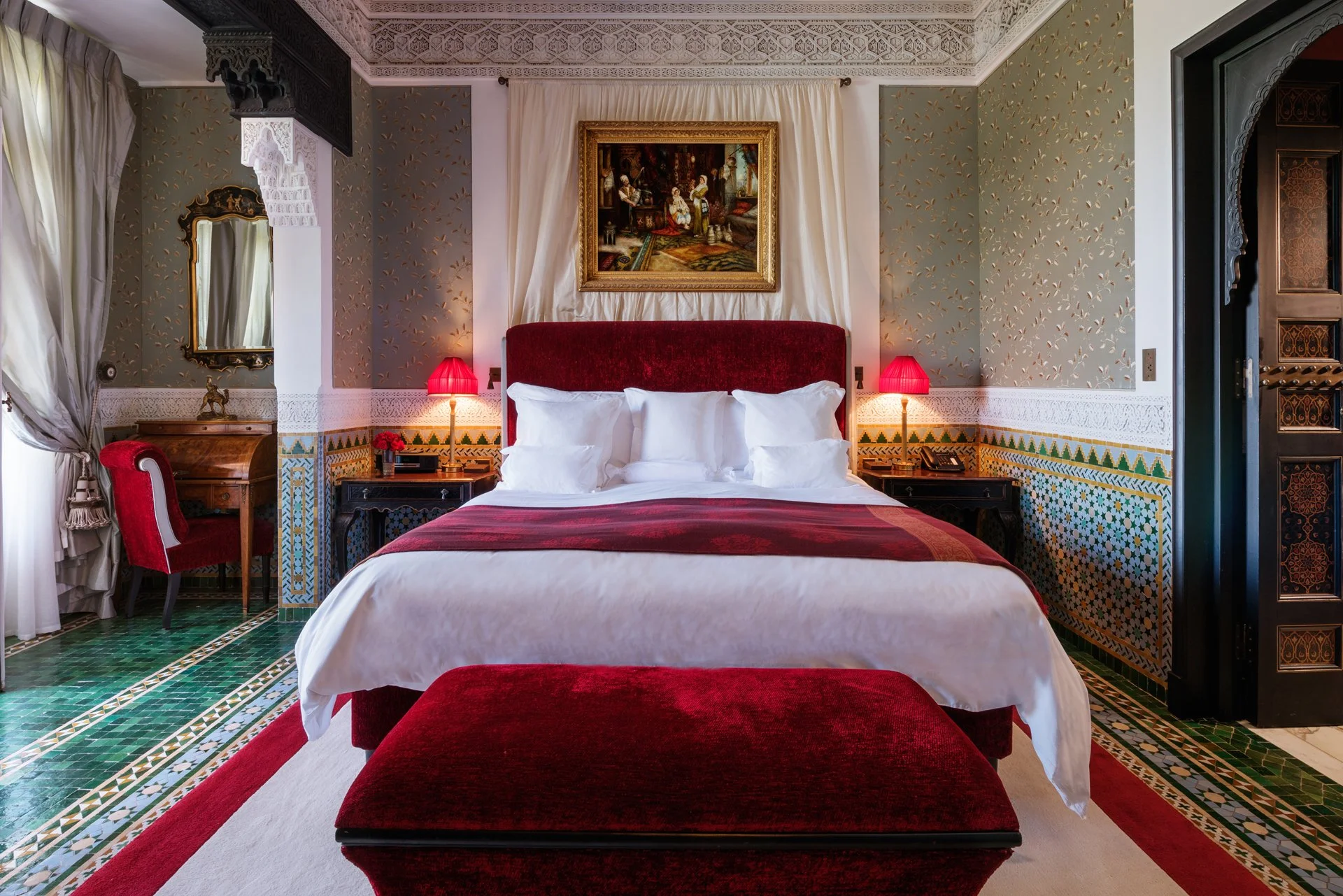 La Mamounia luxury suite with red velvet headboard, Marrakech - five-star accommodation on Southern Oasis desert tour