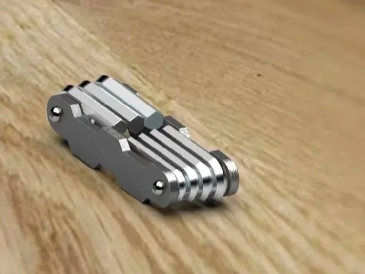 Small allen key set, lying closed on a wooden surface.