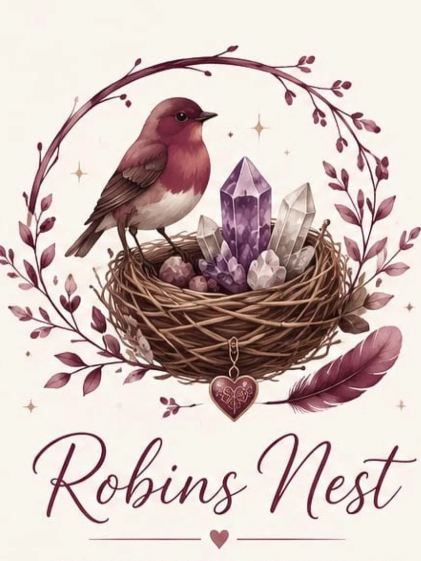 Illustration of a bird sitting in a nest with crystals, flowers, and a heart-shaped charm, surrounded by purple and pink leaves, with the text "Robins Nest" below.