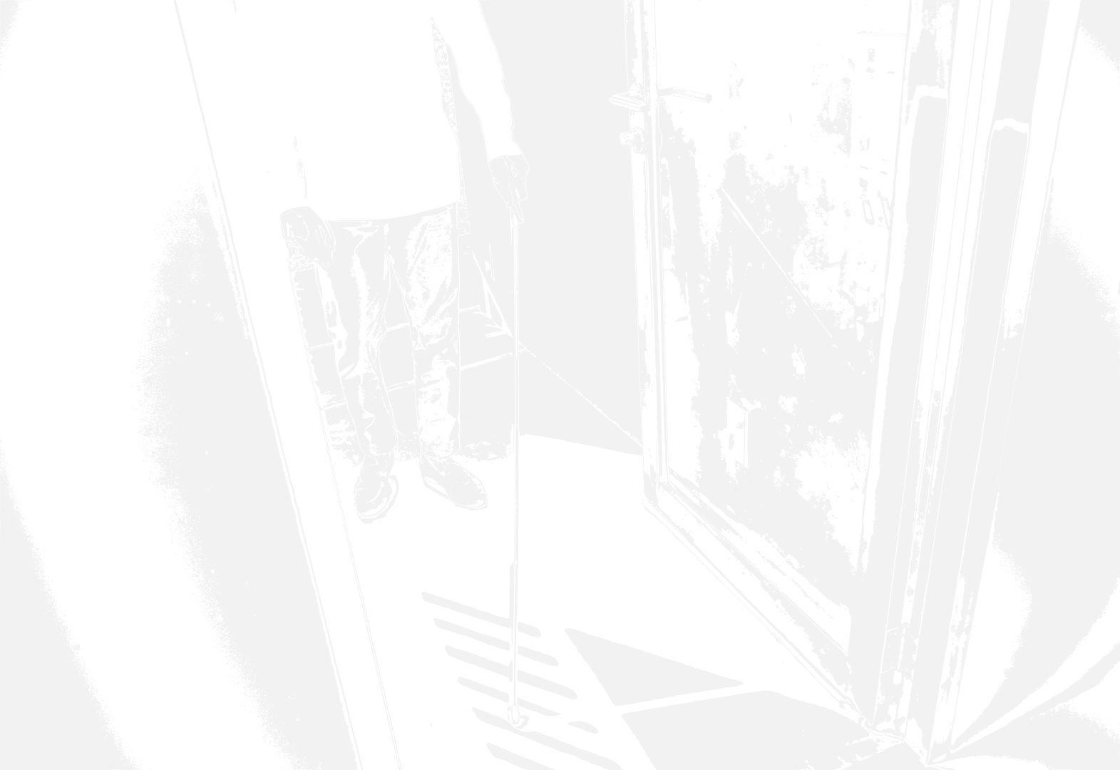 Blind person with cane in doorway.