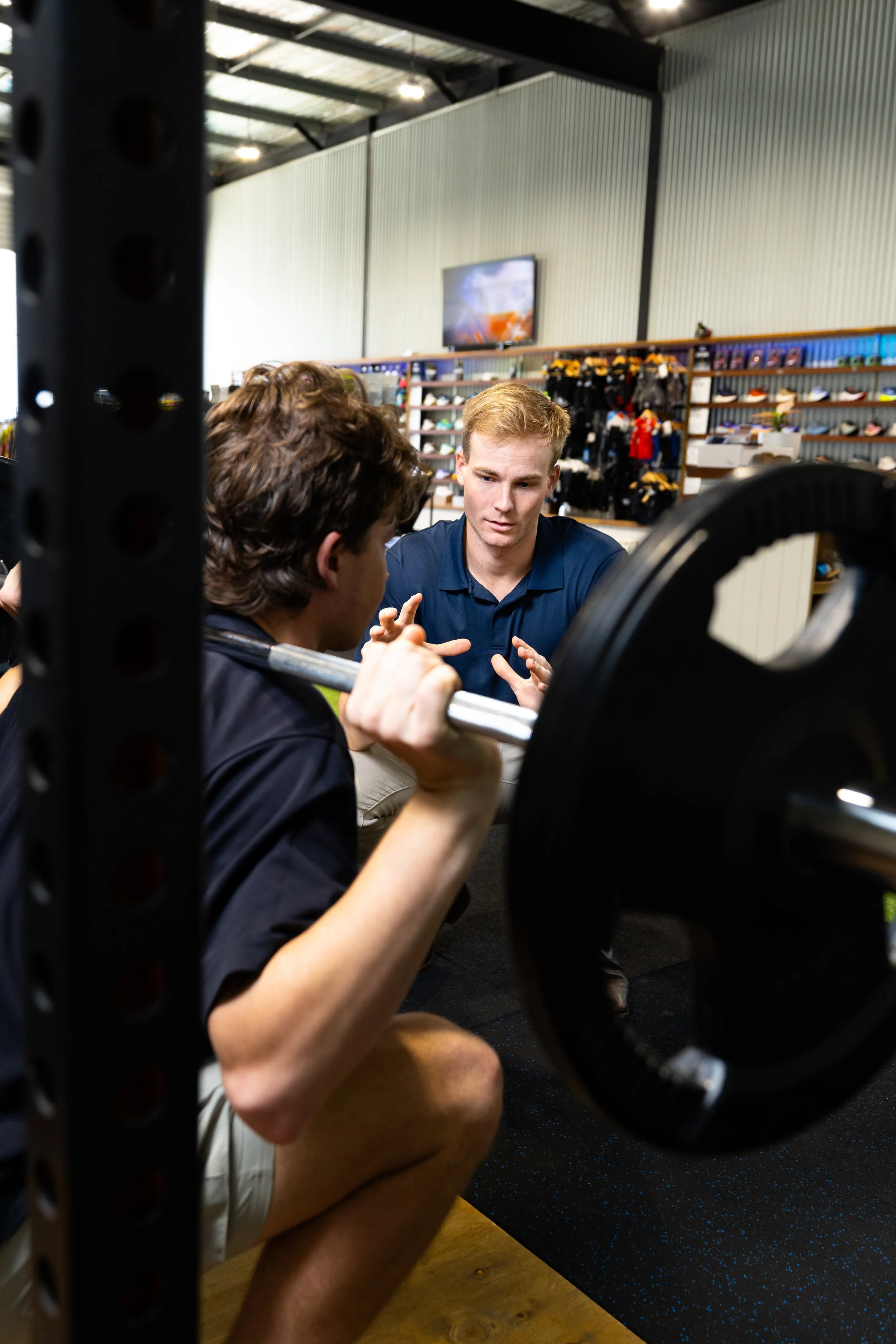 Client performing strength rehabilitation and weight training at KOR Physio