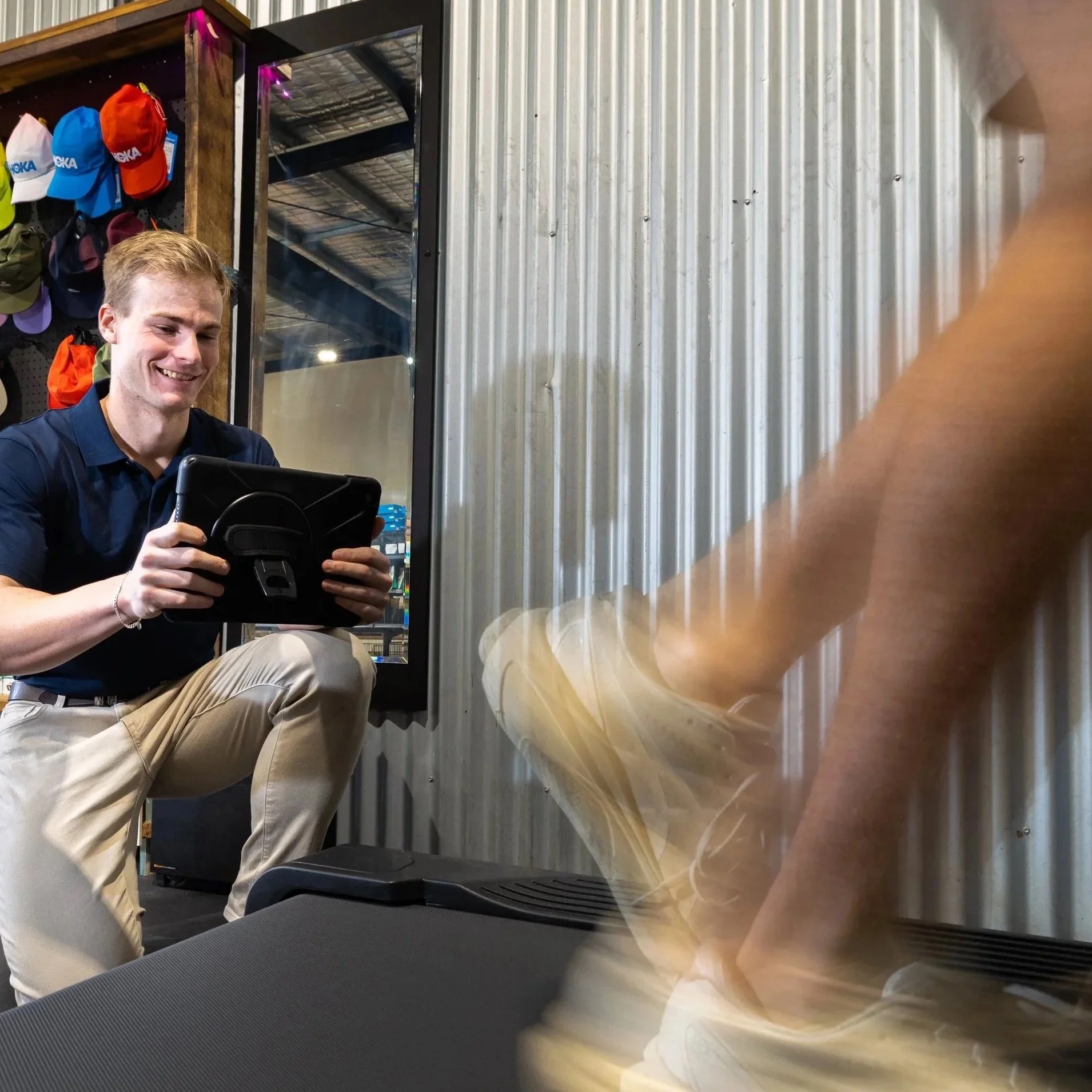 A physiotherapist performing a running assessment at a clinic in east Brisbane