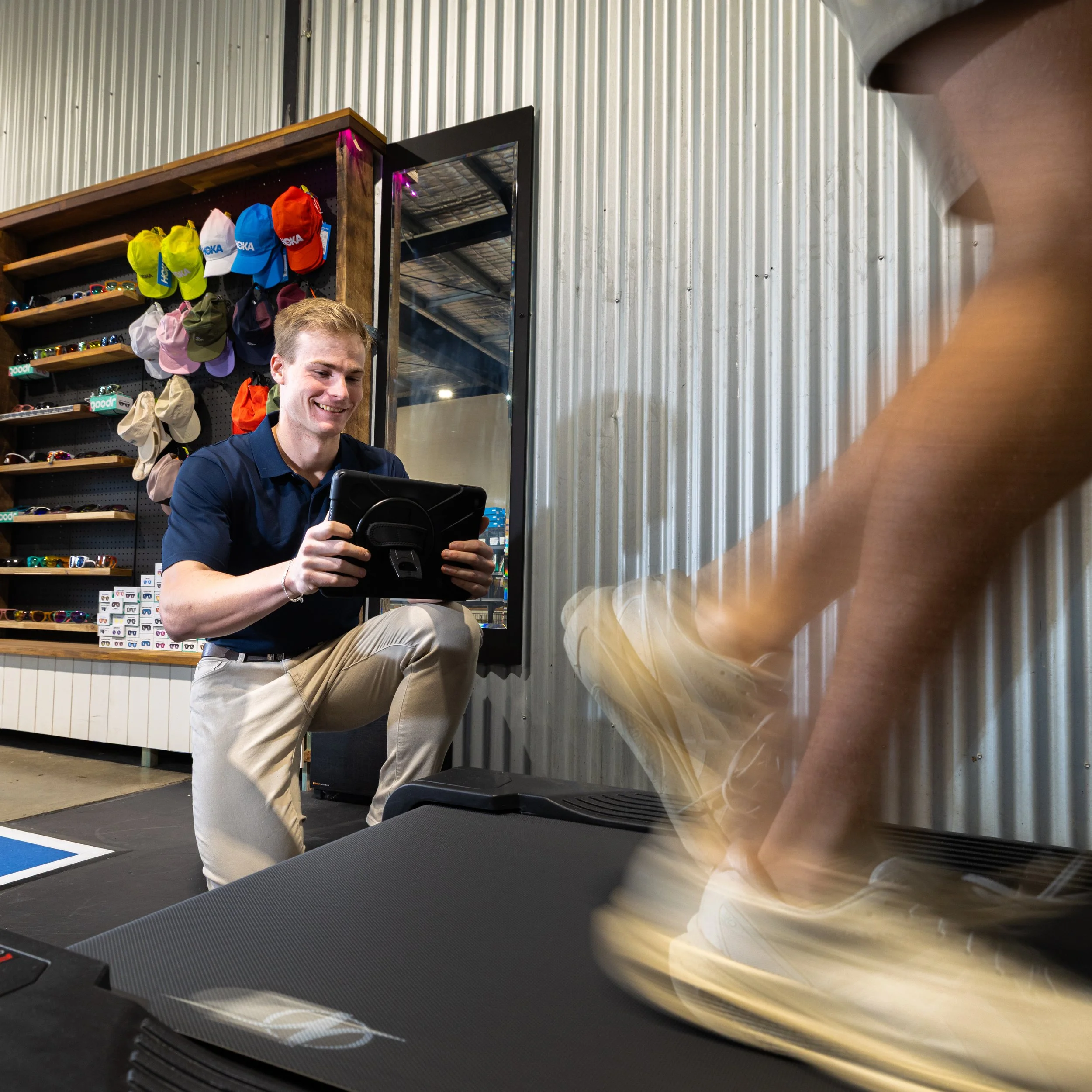 A physio performing a running assessment with a client at KOR Physio
