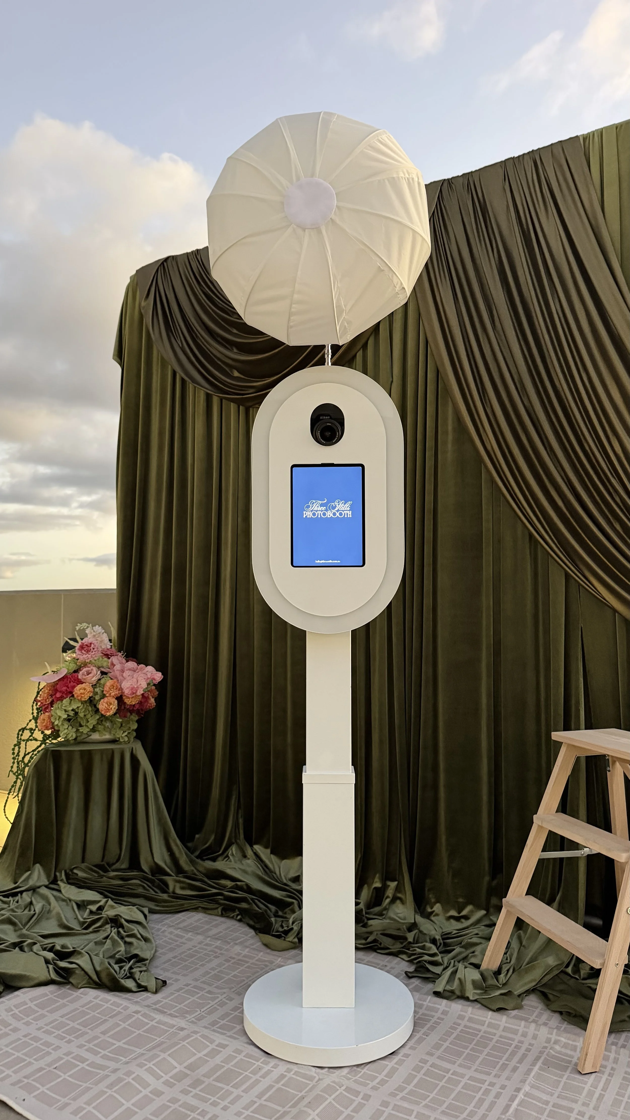 Elegant white open-air photo booth setup for a Sydney wedding event