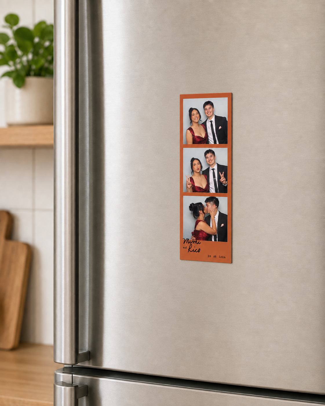 Photo booth strip on refrigerator with three pictures of a woman and man in formal attire, celebrating, and kissing with handwritten message and date.