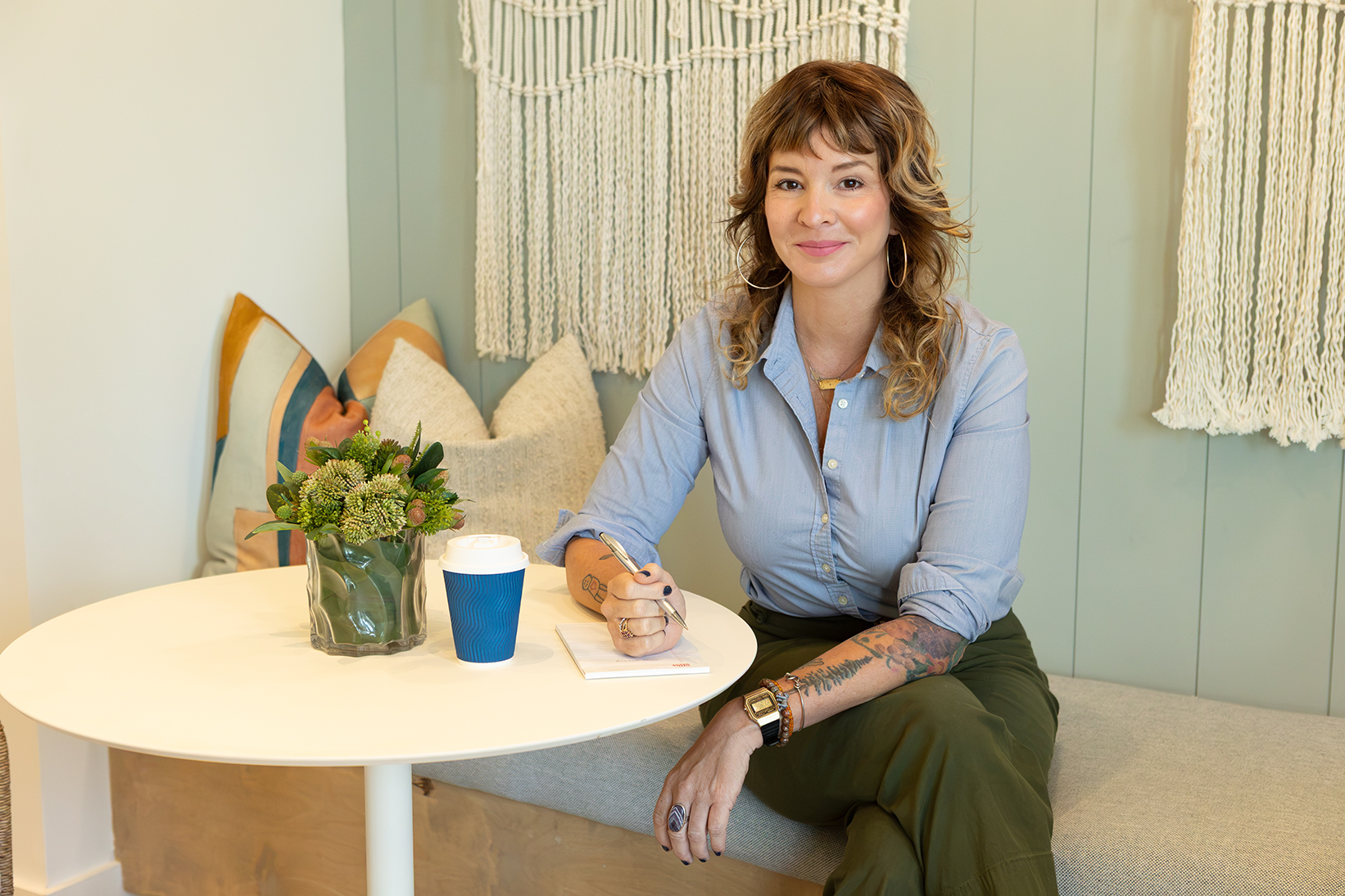 Dr. Sabrina O’Kennon seated with a notebook for a professional consultation.