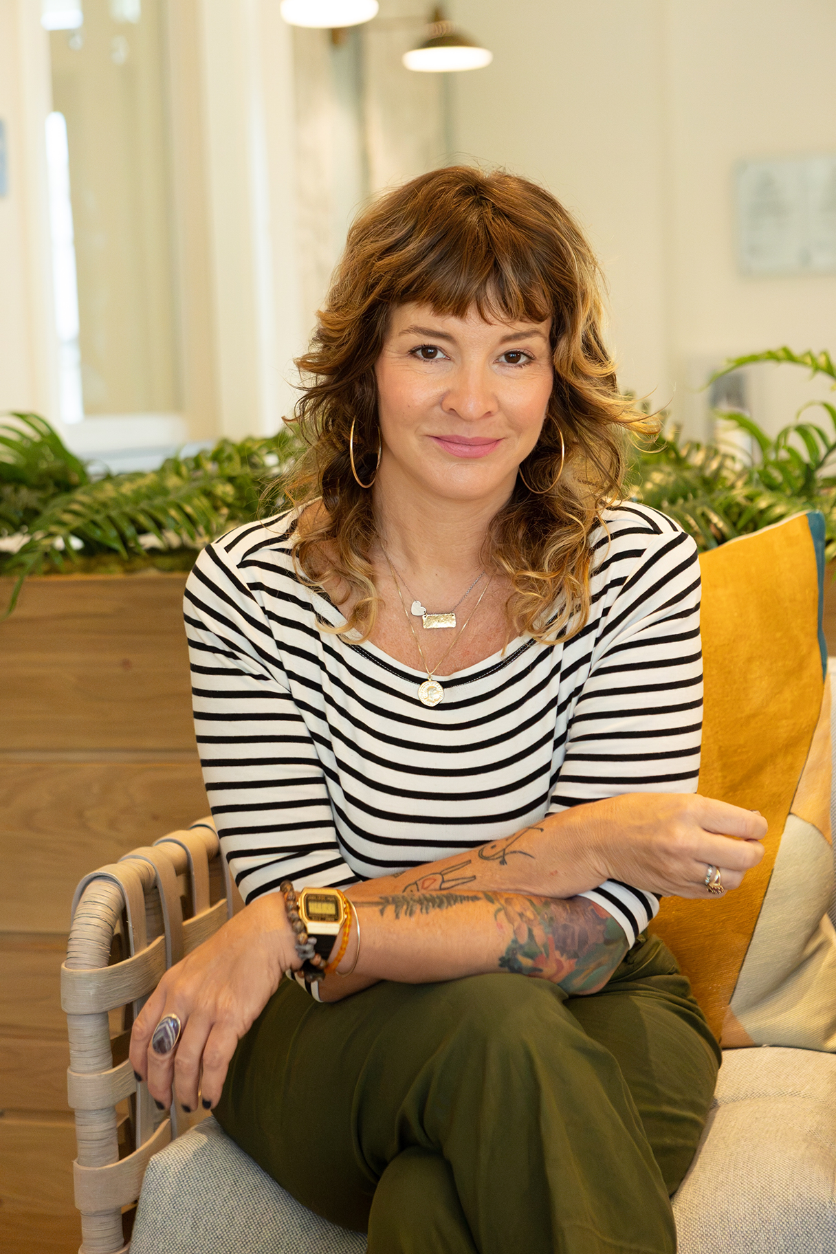Dr. Sabrina O’Kennon seated at a table in a welcoming professional setting.