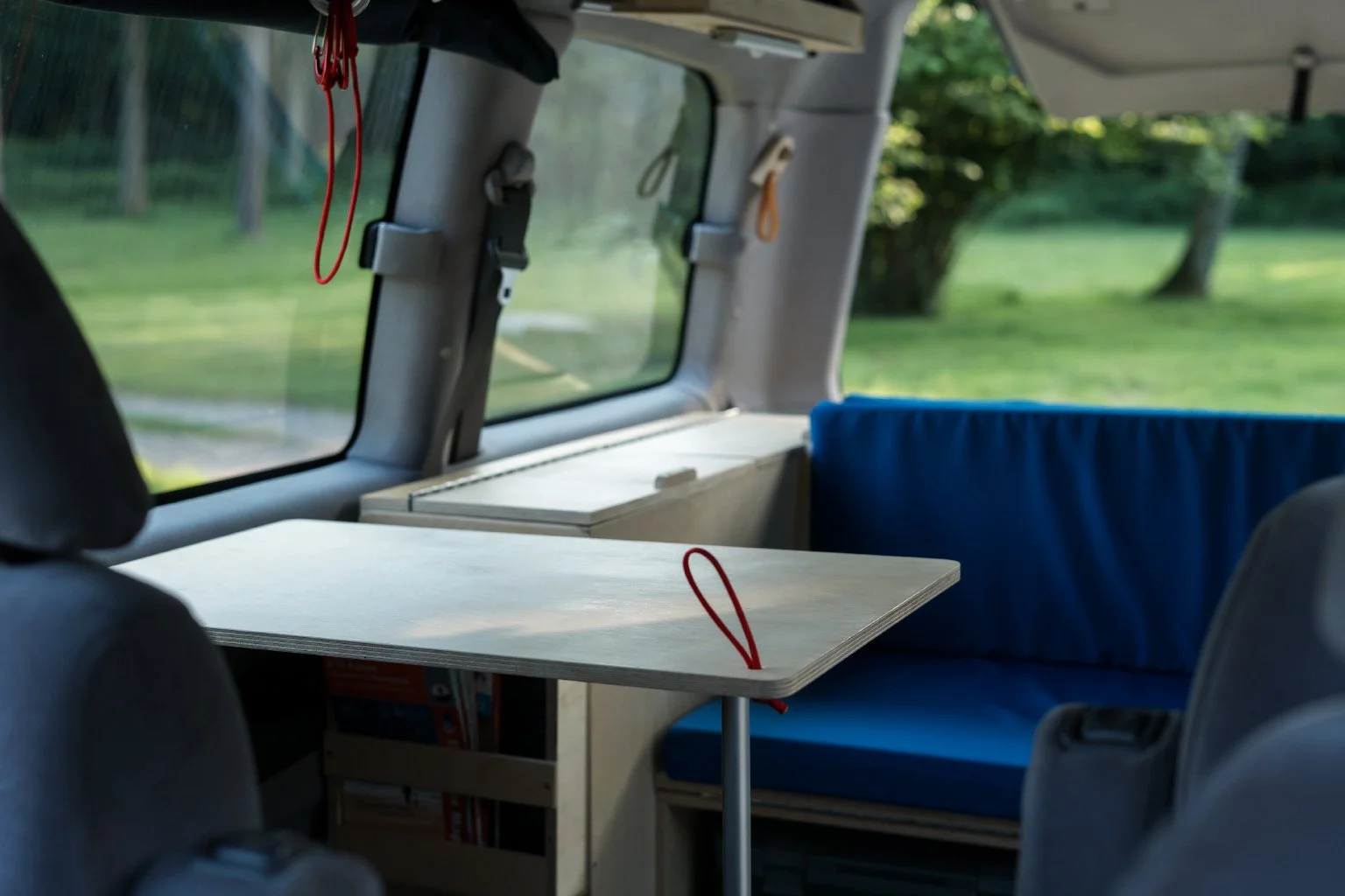  Folding table supported by telescopic leg 