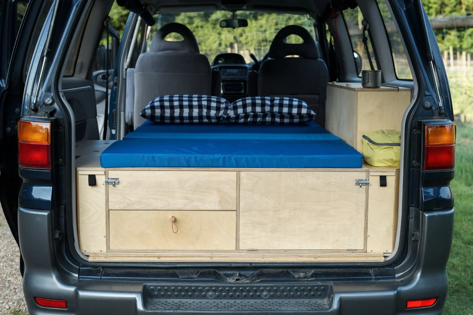  Camper unit folded down to make sleeping platform 