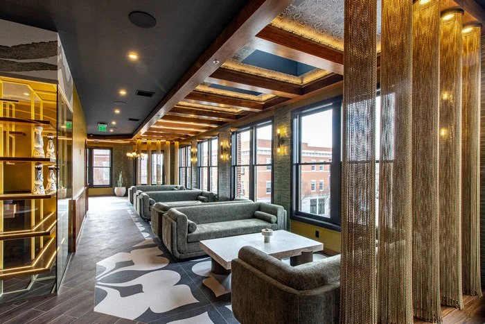 Gustavo's Mexican Grill - Louisville KY - Modern lounge interior highlighting a custom wood ceiling with integrated lighting and decorative detailing, emphasizing warm wood tones and refined craftsmanship that shape the atmosphere of the space.