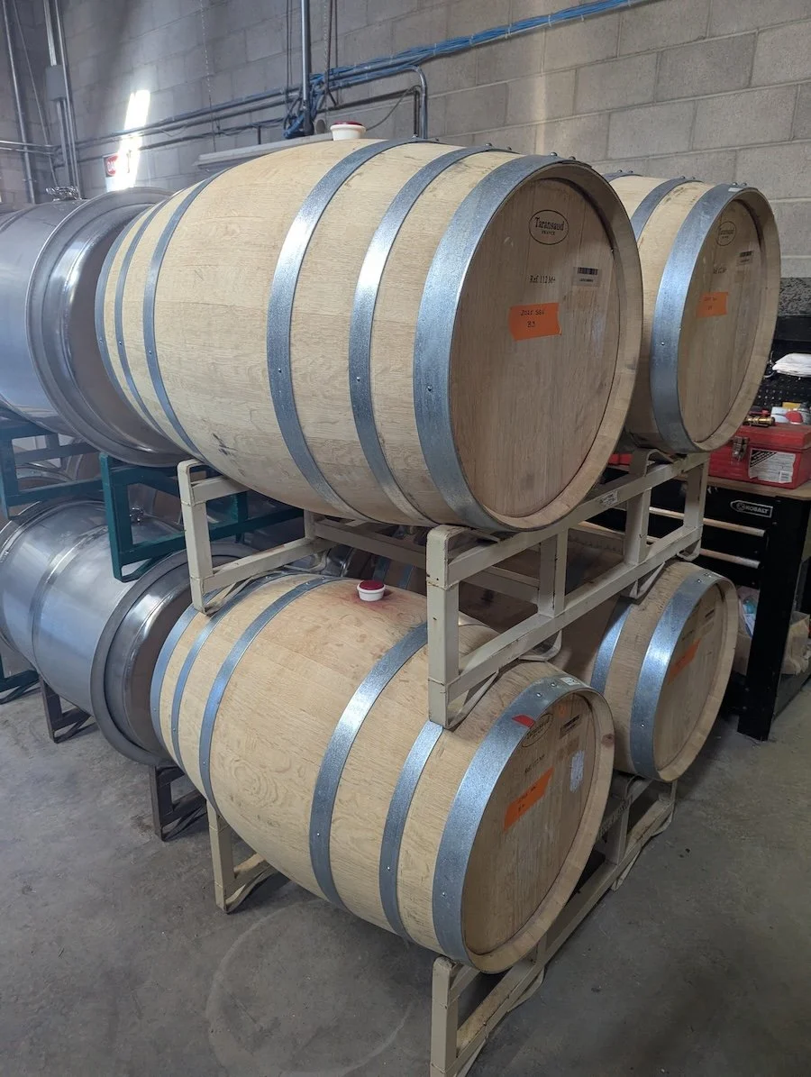 Wooden and metal wine barrels