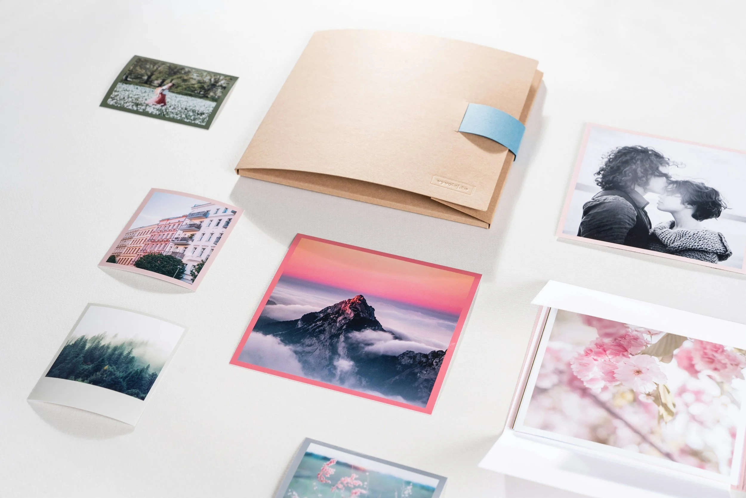 A collection of printed photographs. Organize and sort digital photos