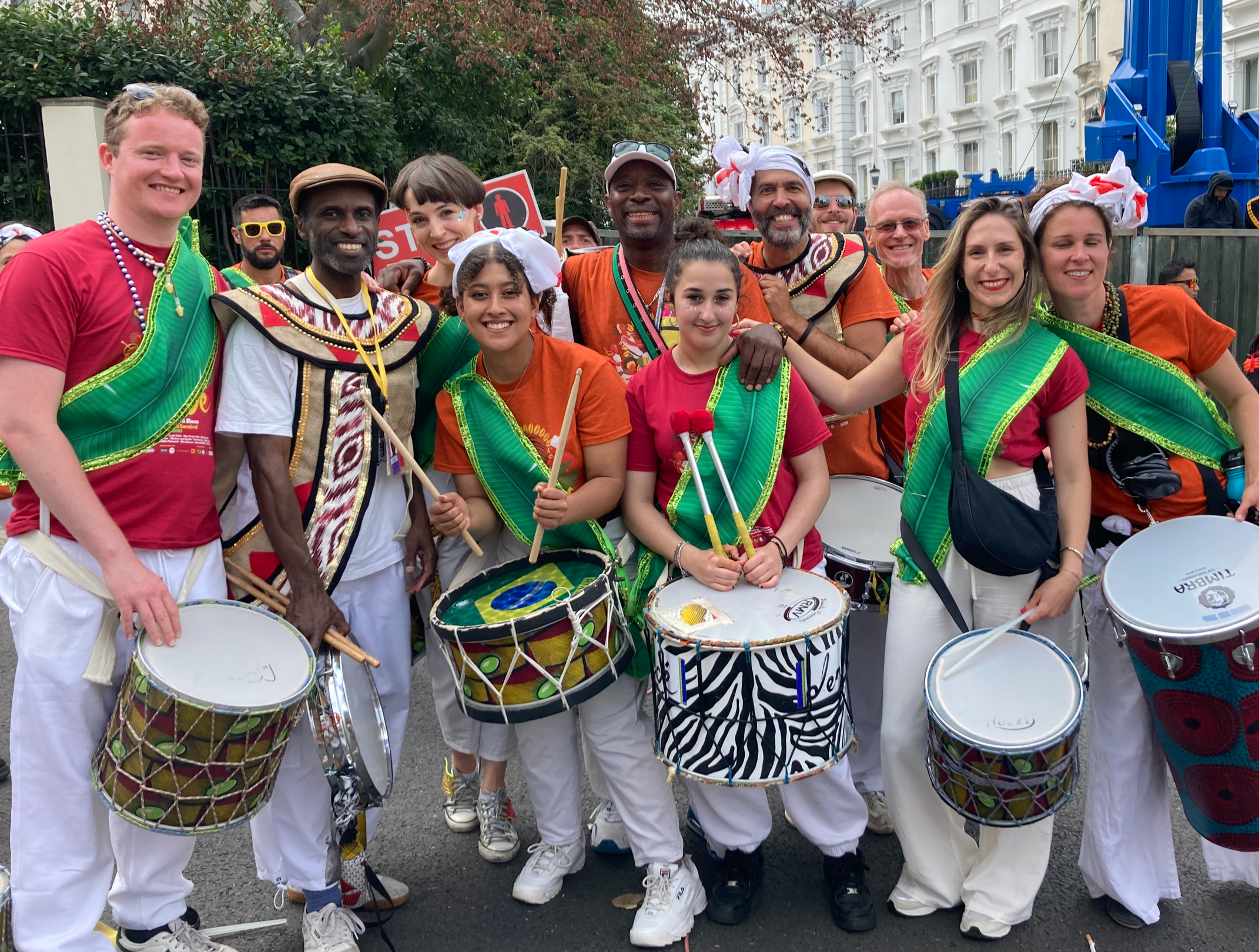 Join our group link with image showing drummer in Notting Hill Carnival costumes