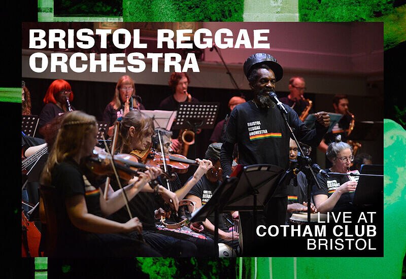 Bristol Reggae Orchestra performing live at Cotham Club in Bristol, featuring musicians playing various instruments on stage.