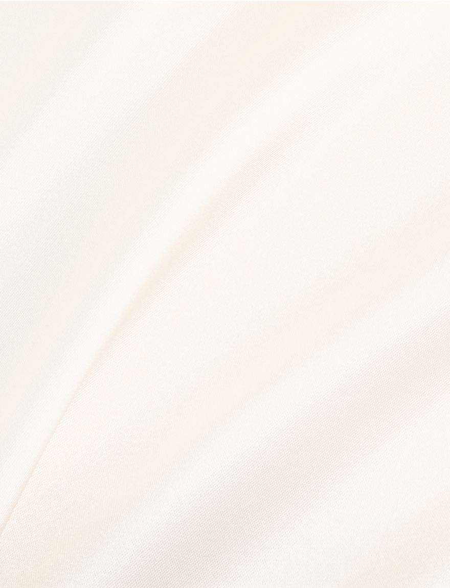Close-up of a white fabric with a smooth, slightly textured surface.