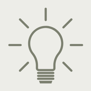 Line drawing of a light bulb with rays of light around it