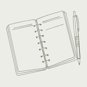 Open spiral-bound notebook with lined pages and a pen placed beside it.