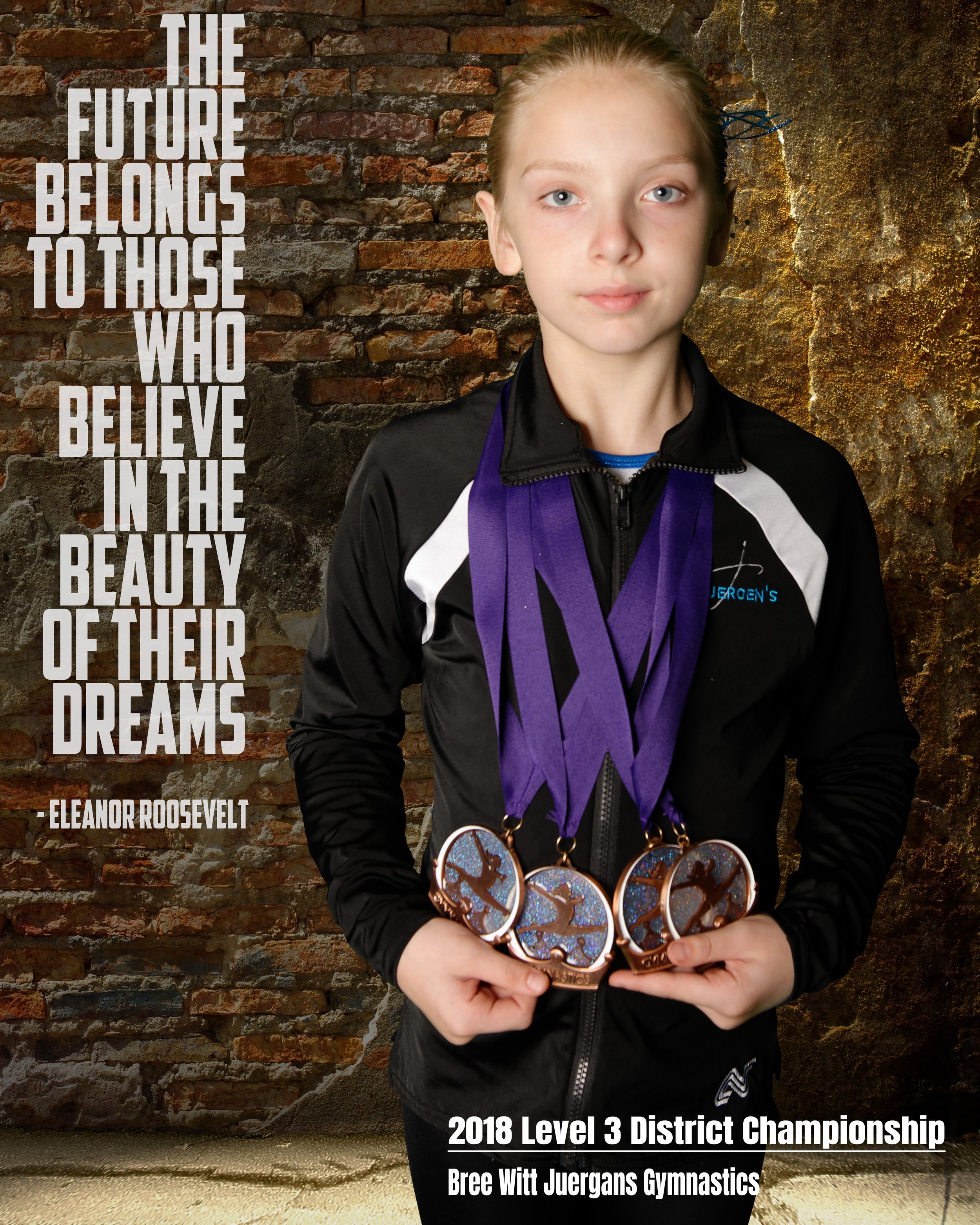 A young girl with blonde hair, blue eyes, and light skin standing in front of a textured brick wall. She is wearing a black jacket with white stripes on the sleeves and a purple medal ribbon around her neck. She is holding three medals with designs f