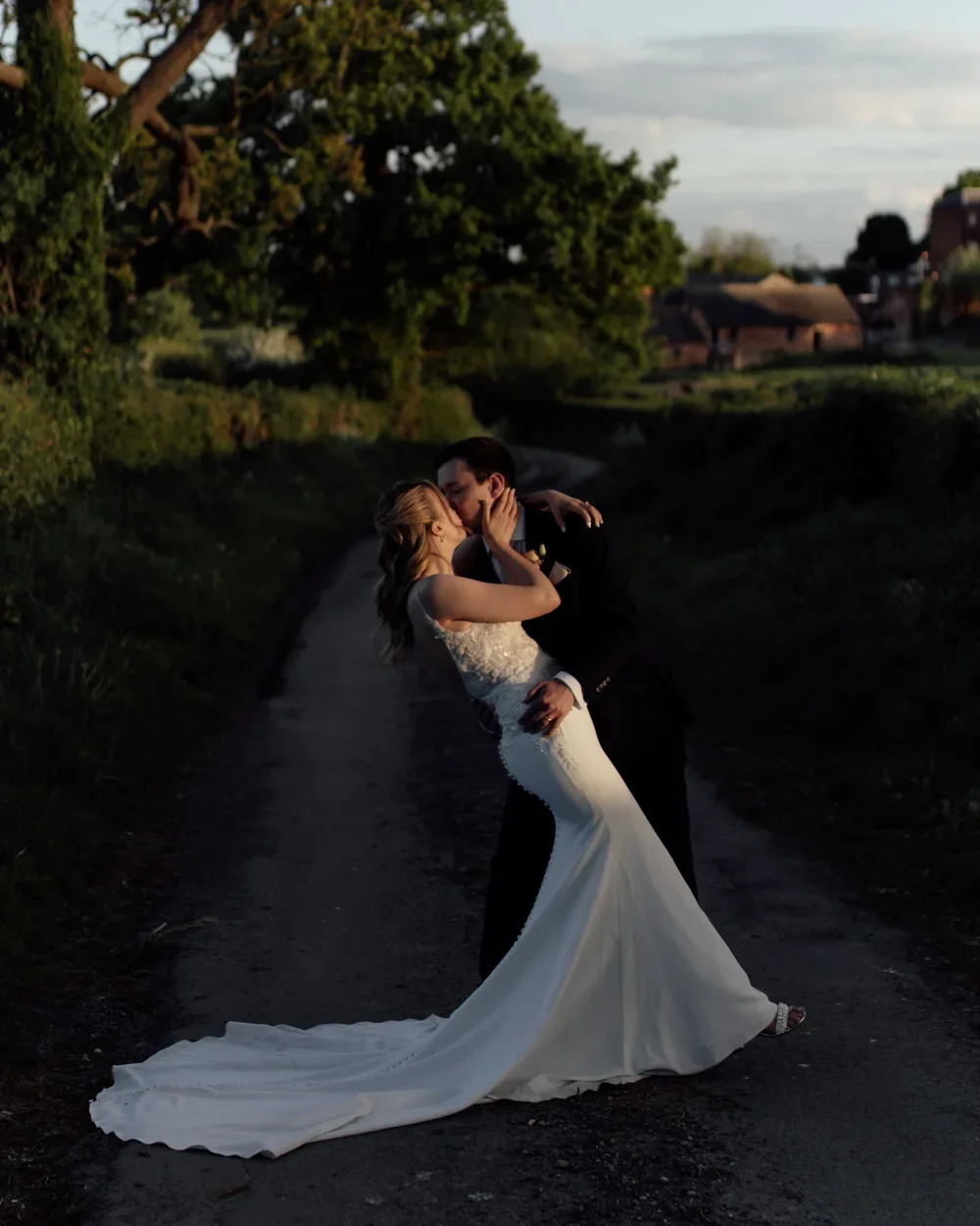 Bride and groom sharing a quiet dance at sunset near Kedleston Country House in Derbyshire.